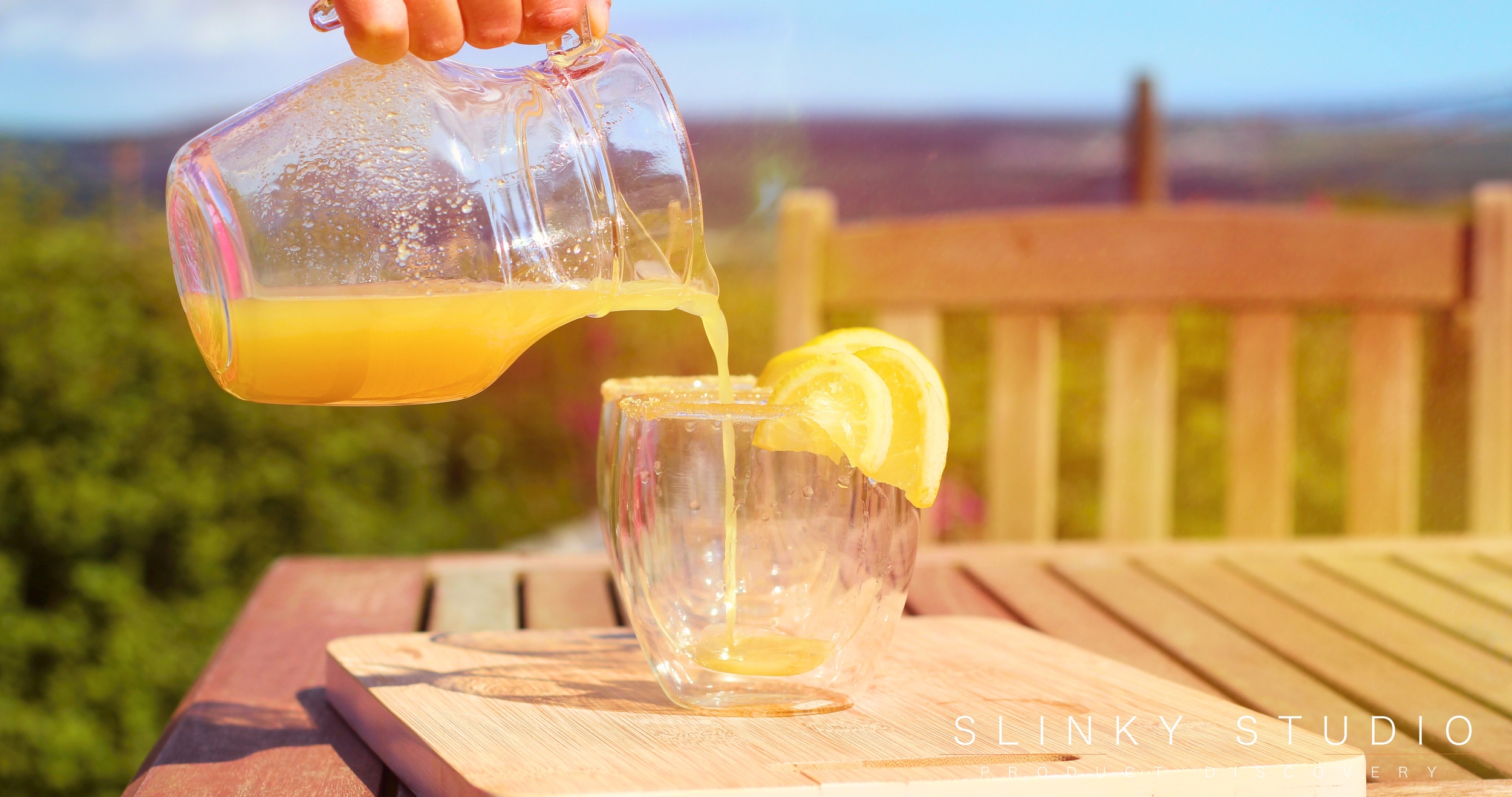 Optimum ThermoCook Ginger Beer Being Poured On Bench in Sun.jpg