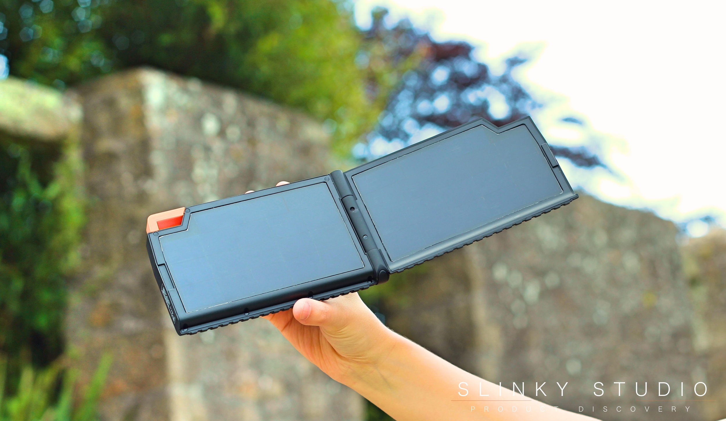 Xtorm Evoke Solar Panel Charger Open Holding in Air.jpg