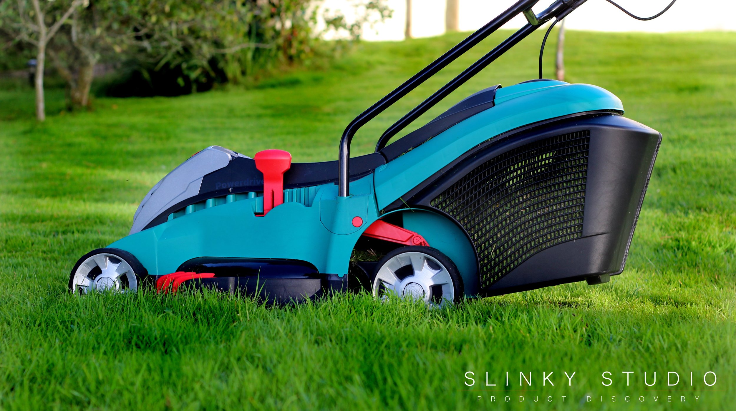 Bosch Rotak 43 LI Ergoflex Cordless Lawnmower Side View Mowing.jpg