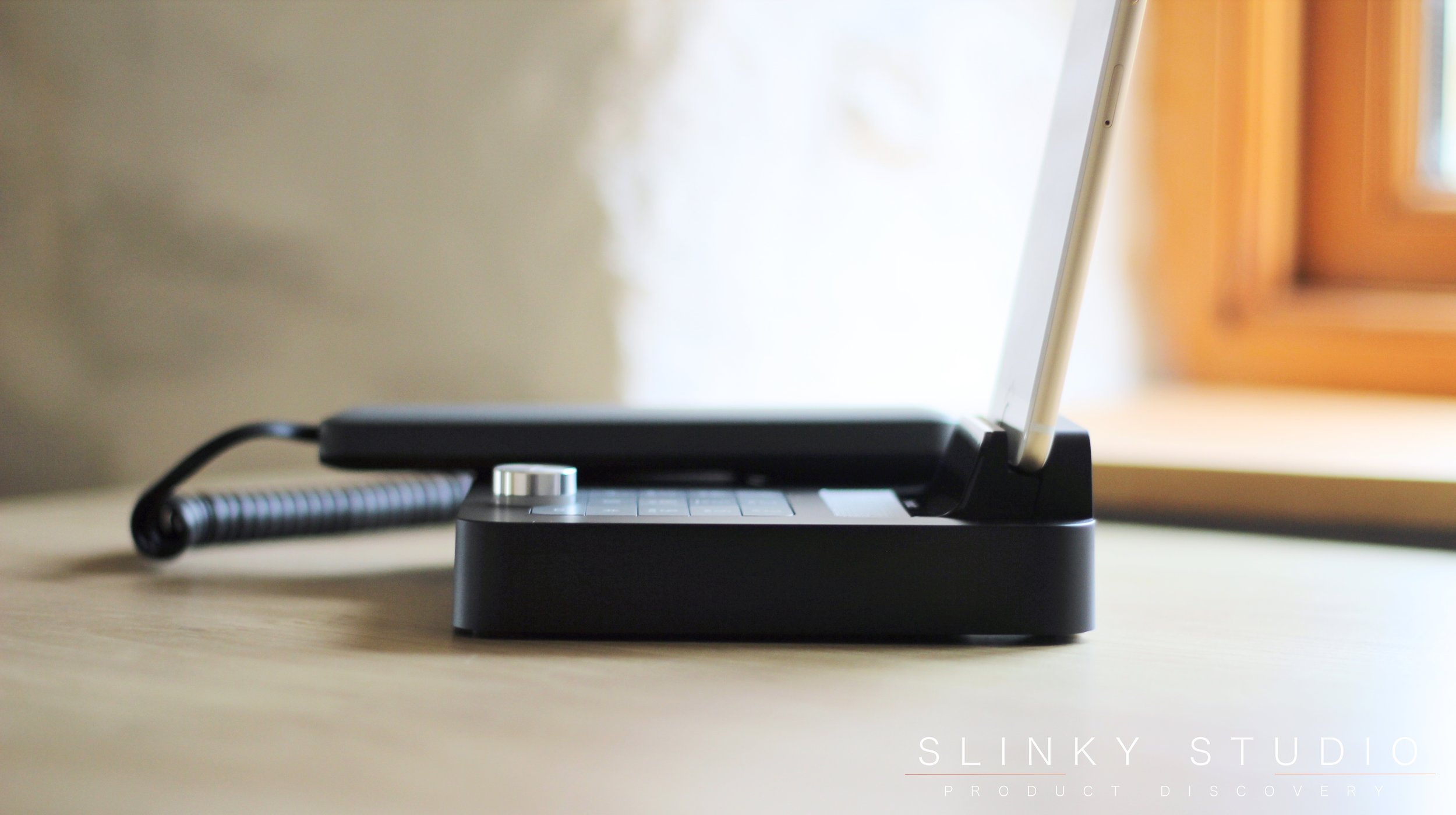 Invoxia NVX 200 Desk Phone Side View iPhone Docked.jpg