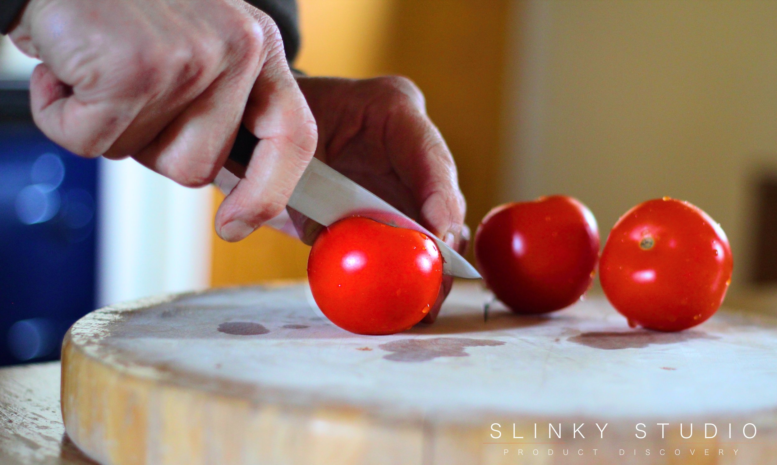 KitchenAid 7pc Professional Series Knife Set Pairing Knife Slicing Tomatoes.jpg