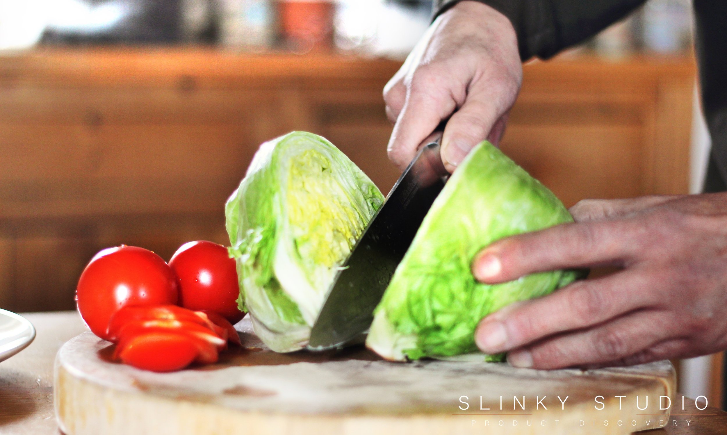 KitchenAid 7pc Professional Series Knife Set 8%22 Chef Lettuce in Half.jpg
