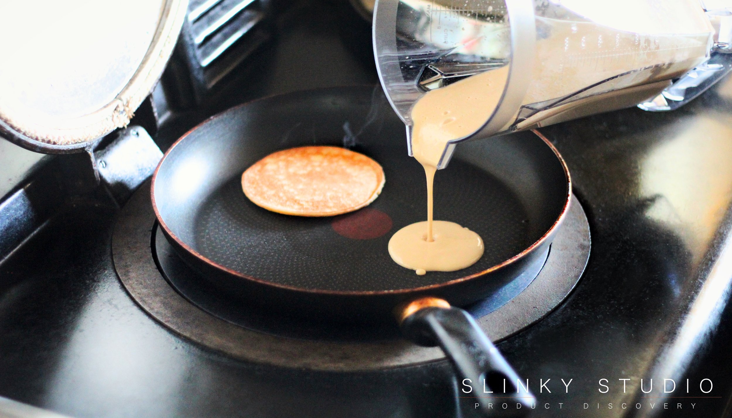 Pancake Mixture Batter Pouring into Frying Pan on Aga - Optimum G2.3 Blender.jpg