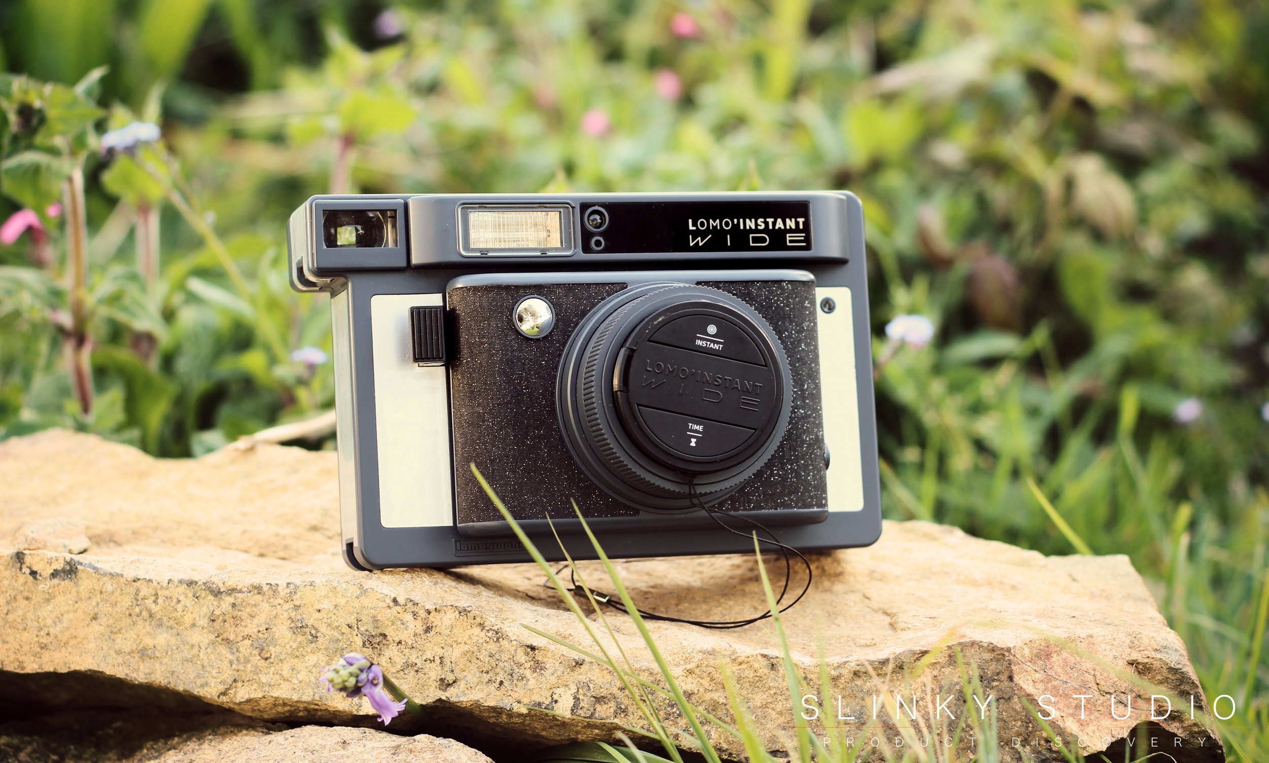 Lomography Lomo’Instant Wide Camera Sitting on Rock Outdoors.jpg