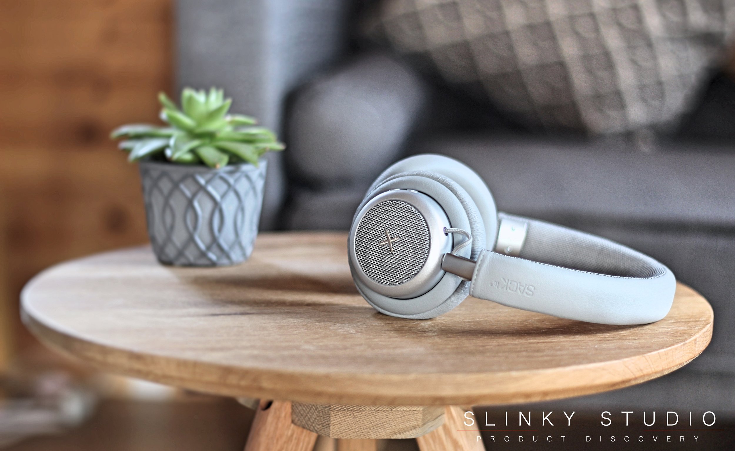 SACKit TOUCHit Headphones Silver Wooden Table Next to Succulent.jpg