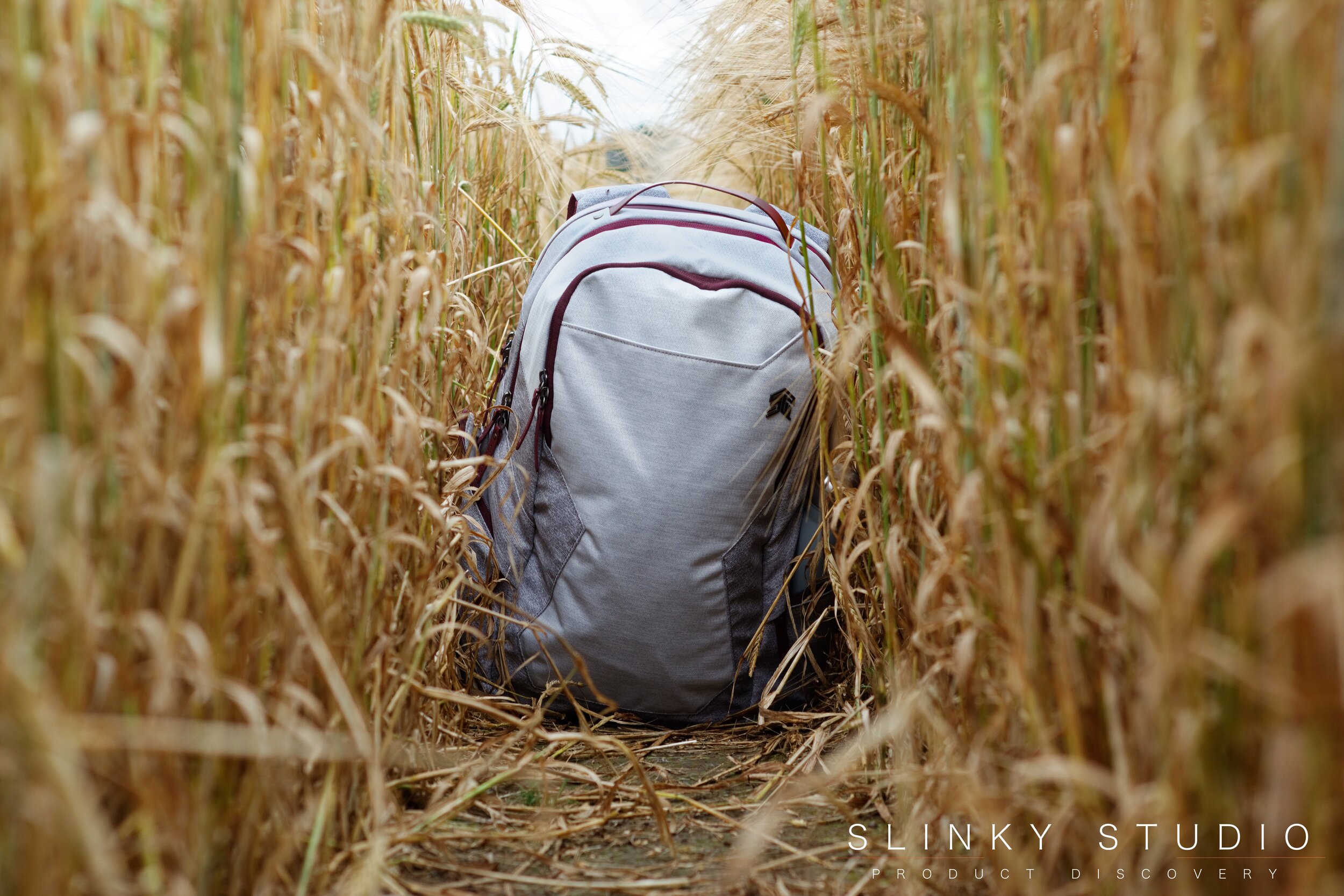 STM Myth Backpack Sitting in a Field.jpg