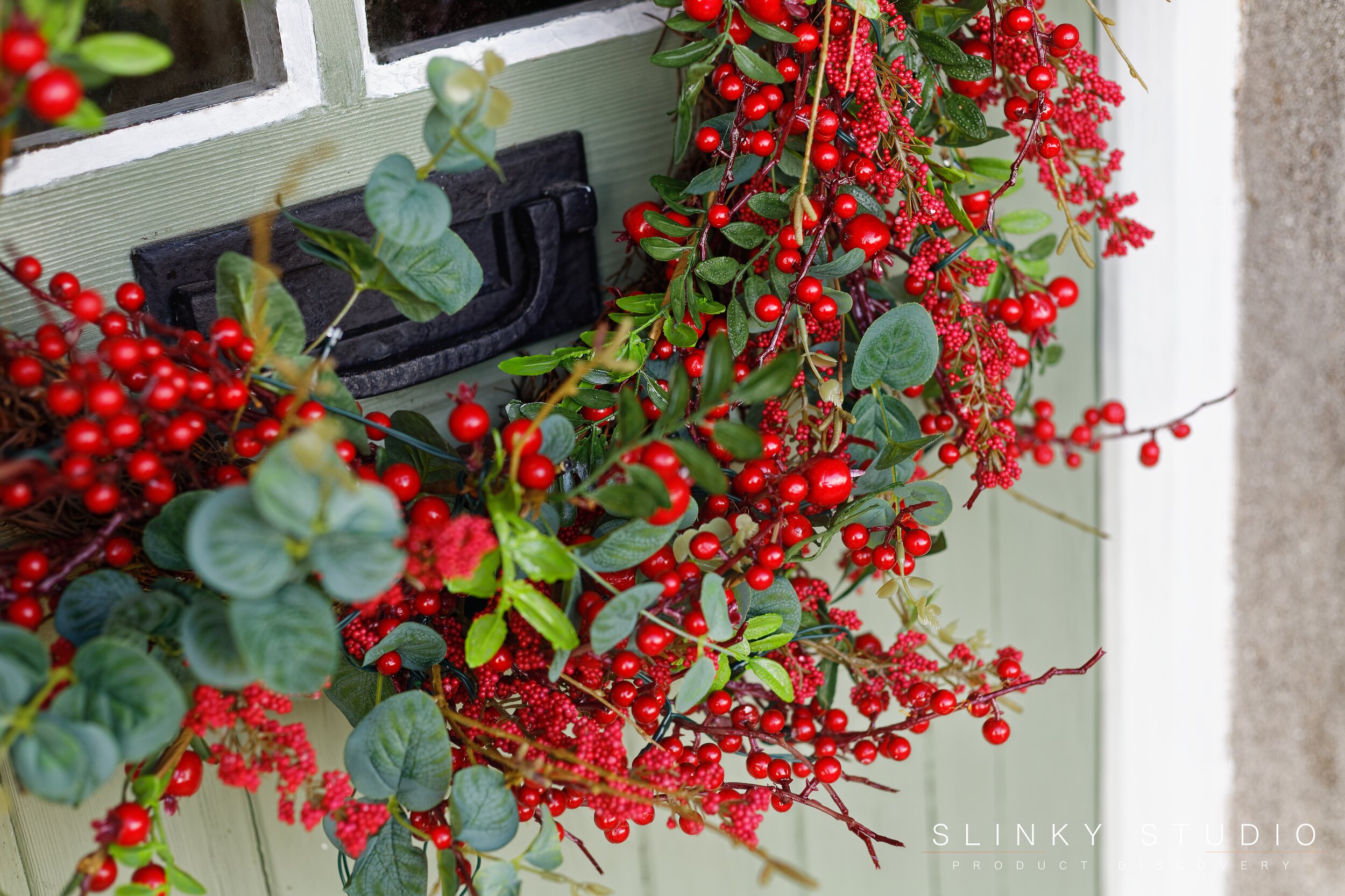 Balsam Hill Mixed Berry Festive Wreath Hanging on Door.jpg