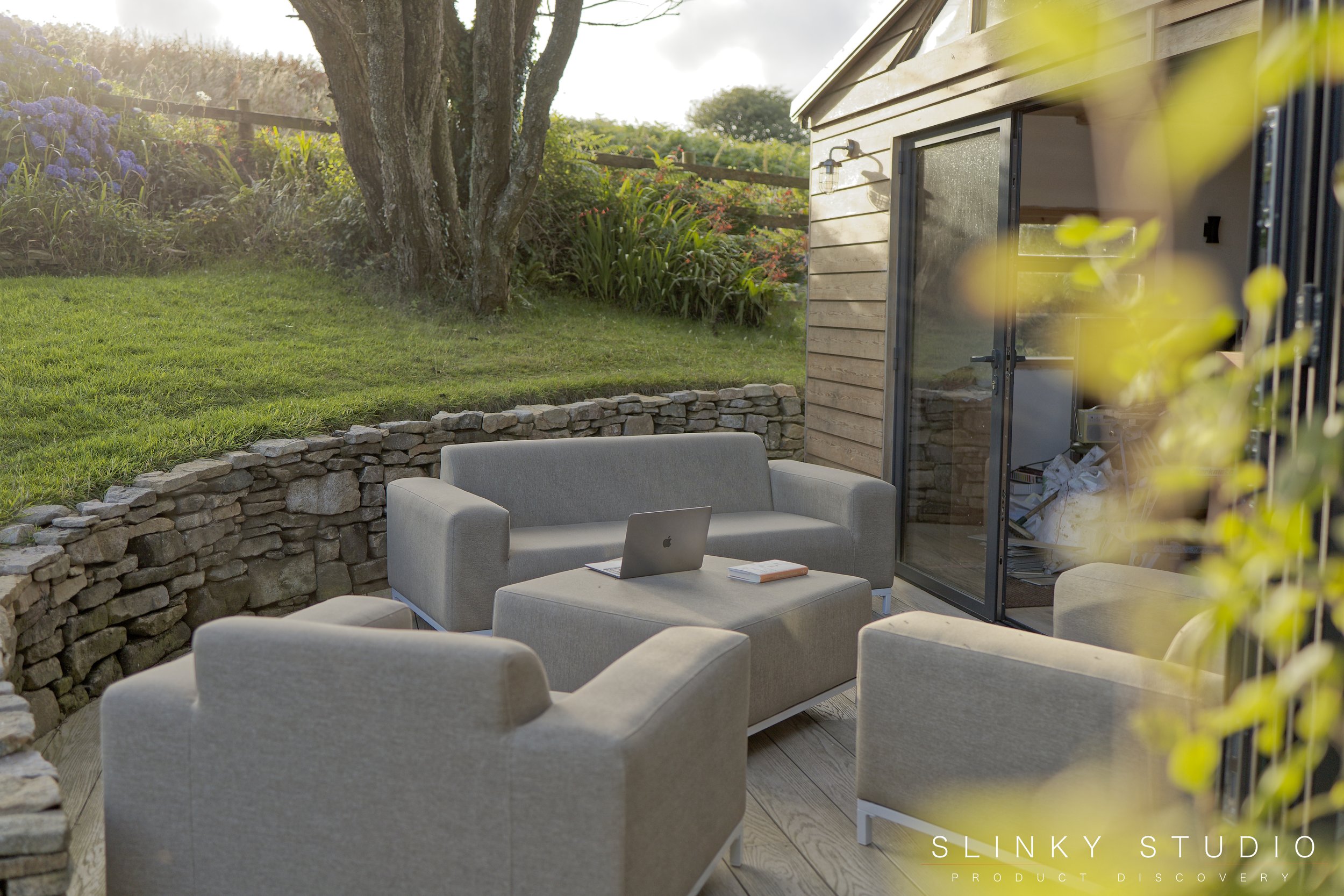 Beliani ROVIGO Sofa Set Outdoor Curved Decking Area Granite Stone Wall.jpg