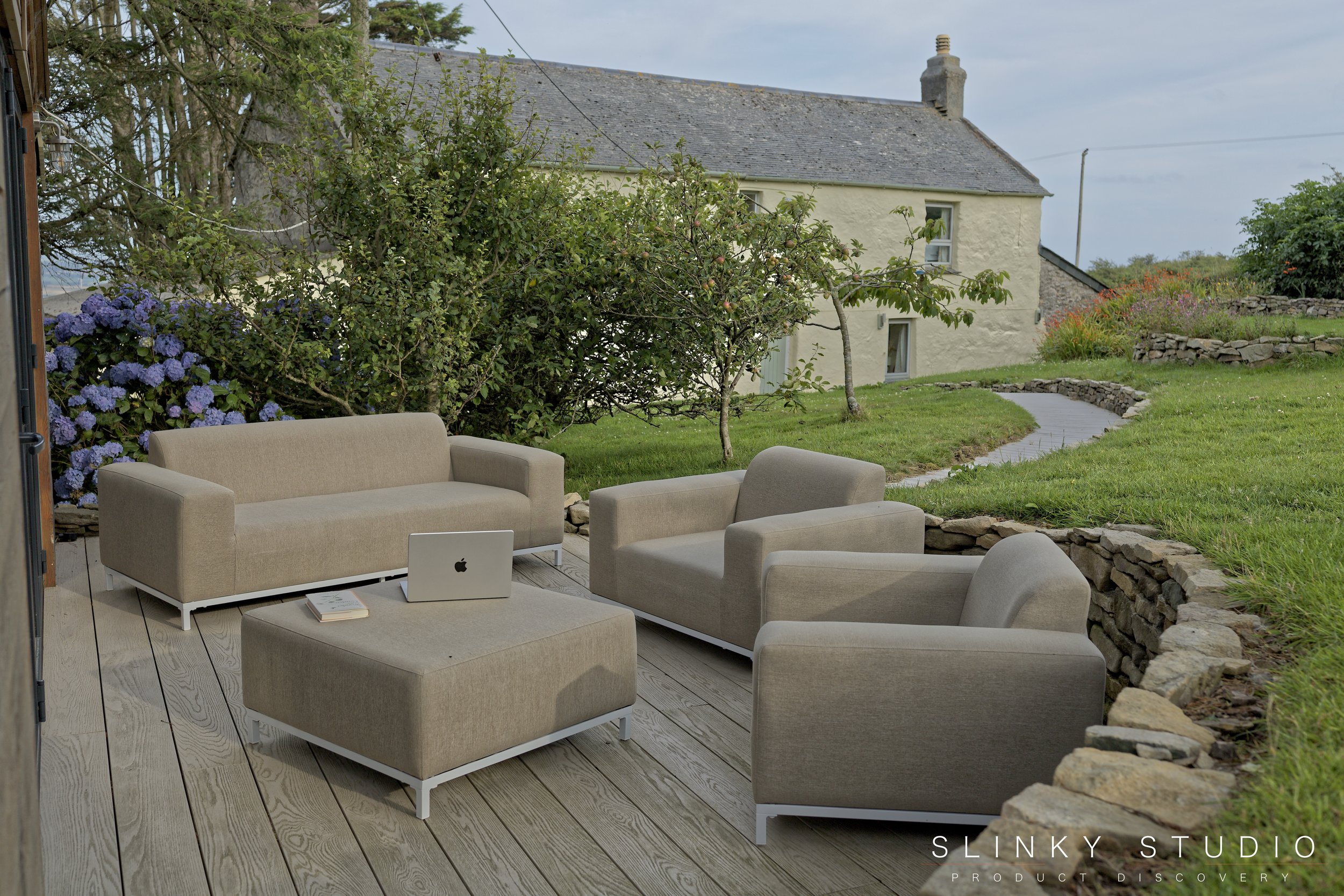 Beliani ROVIGO Sofa Set Outdoor Decking Cornish Cottage Background.jpg