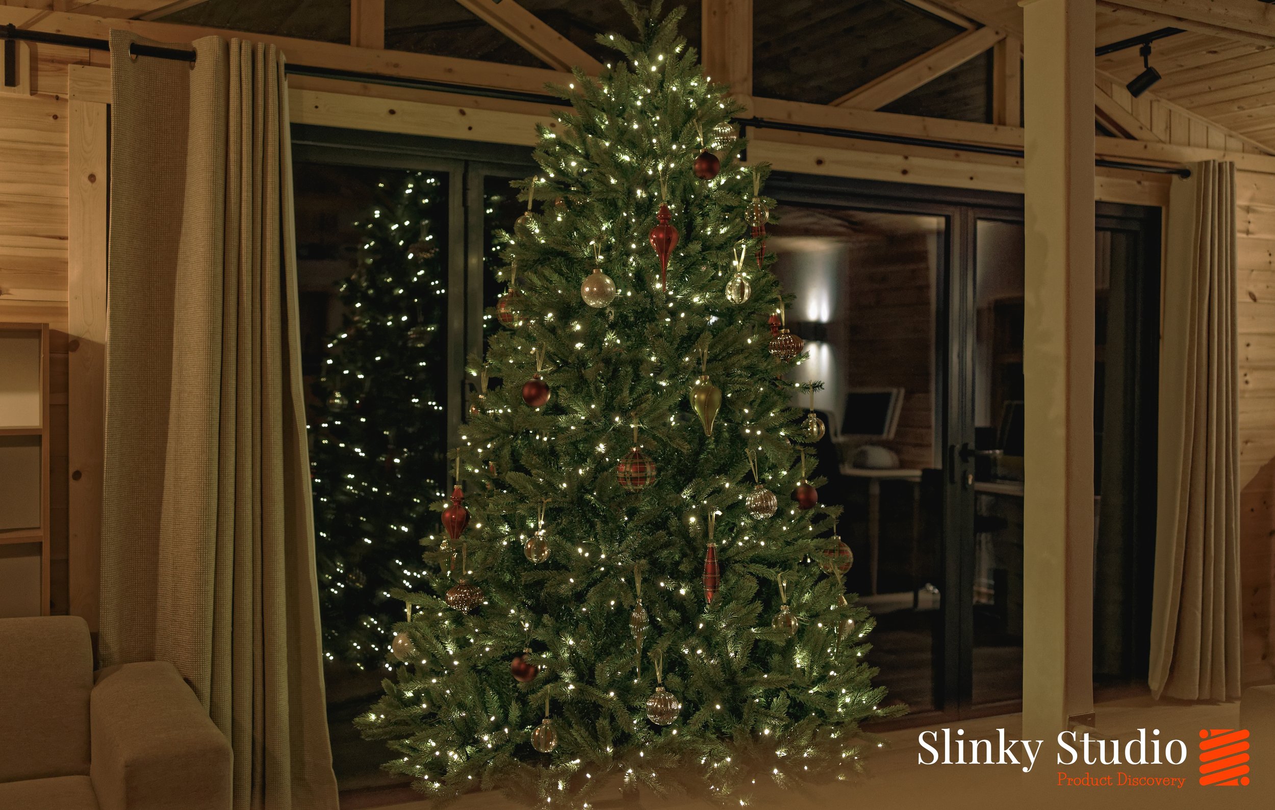 King of Christmas King Fraser Fir Artificial Tree in wooden studio cabin.jpg