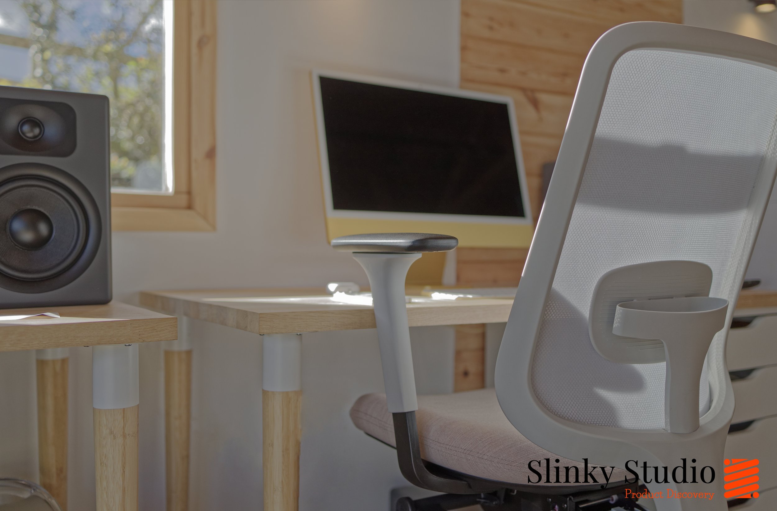 Slouch Chair Task One Grey Frame Close Up Mesh Back Pink Cushion Oak Desks in a Scandi Nordic Studio Enviroment with yellow iMac Side Angle.jpg