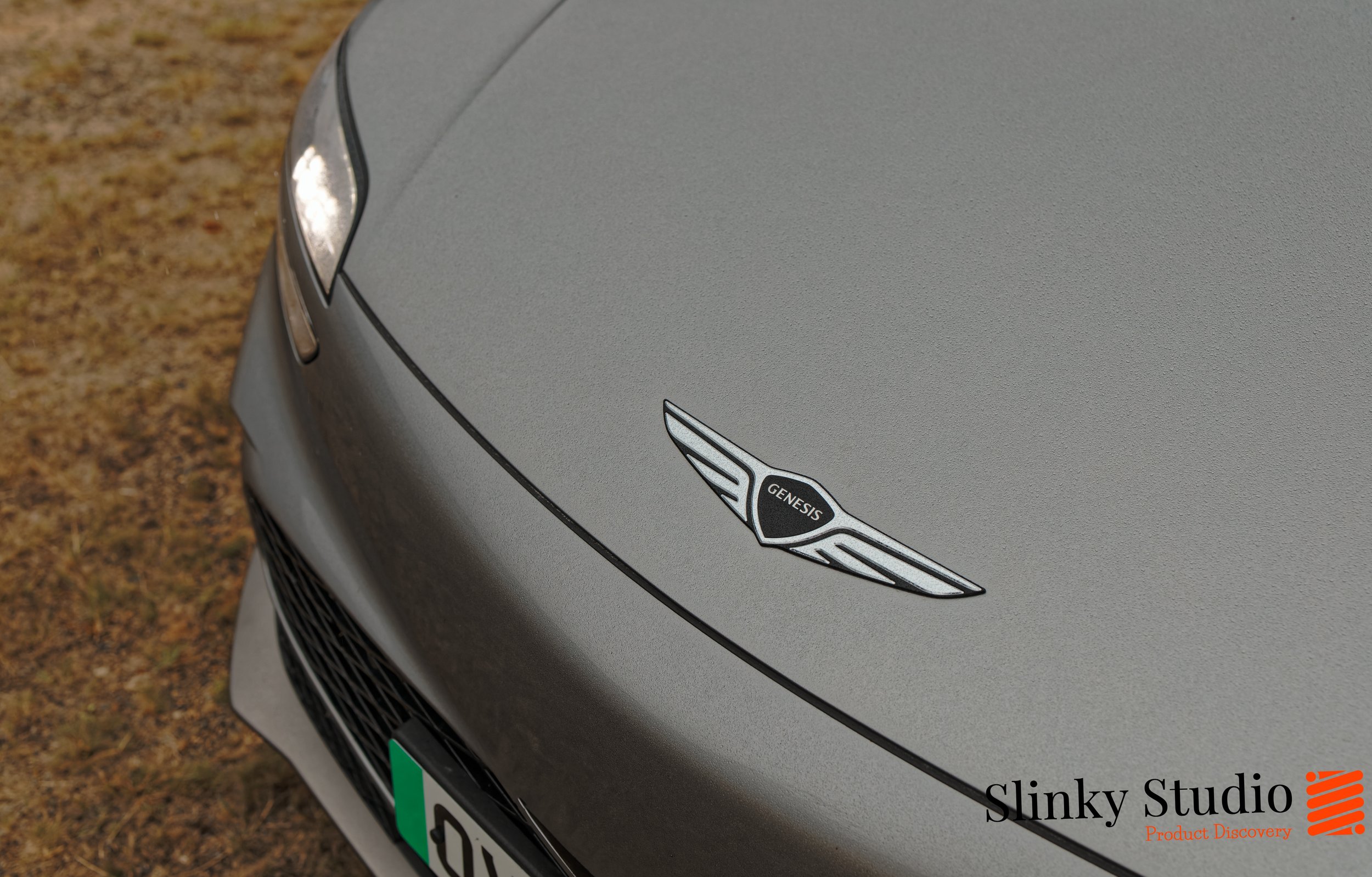 Genesis GV60 Logo Close Up.jpg