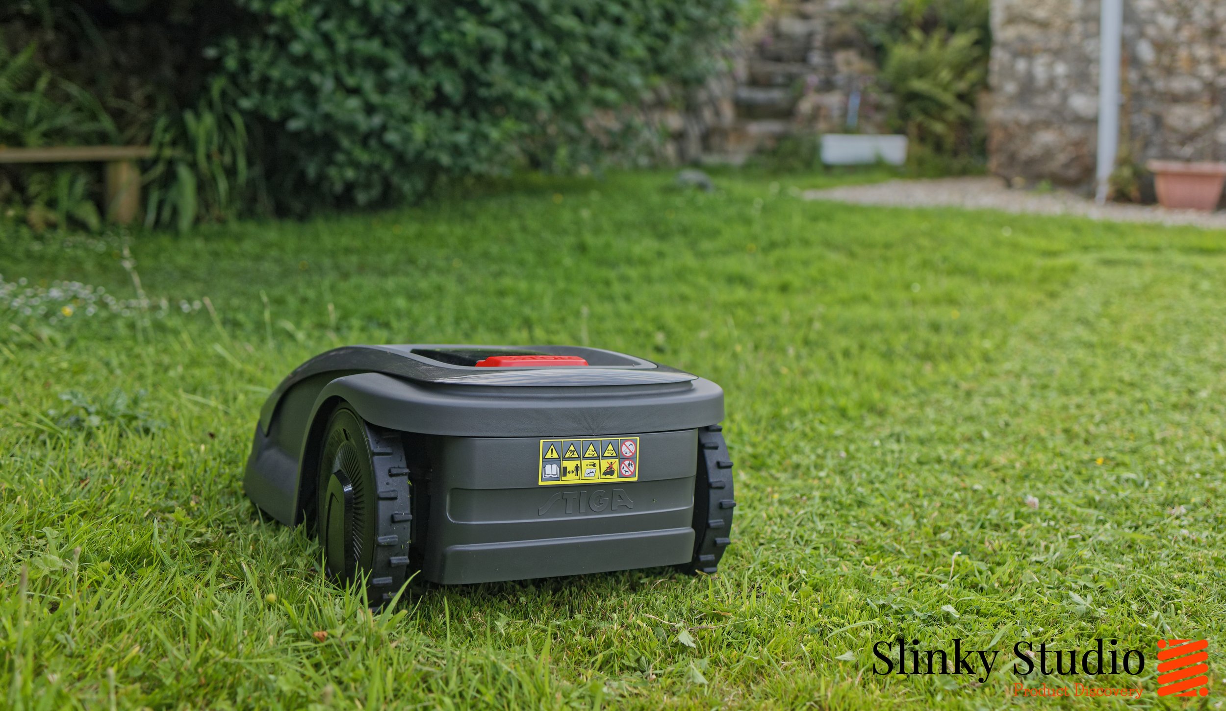 Stiga A4 Robot Lawnmower Rear View Cutting Grass.jpg