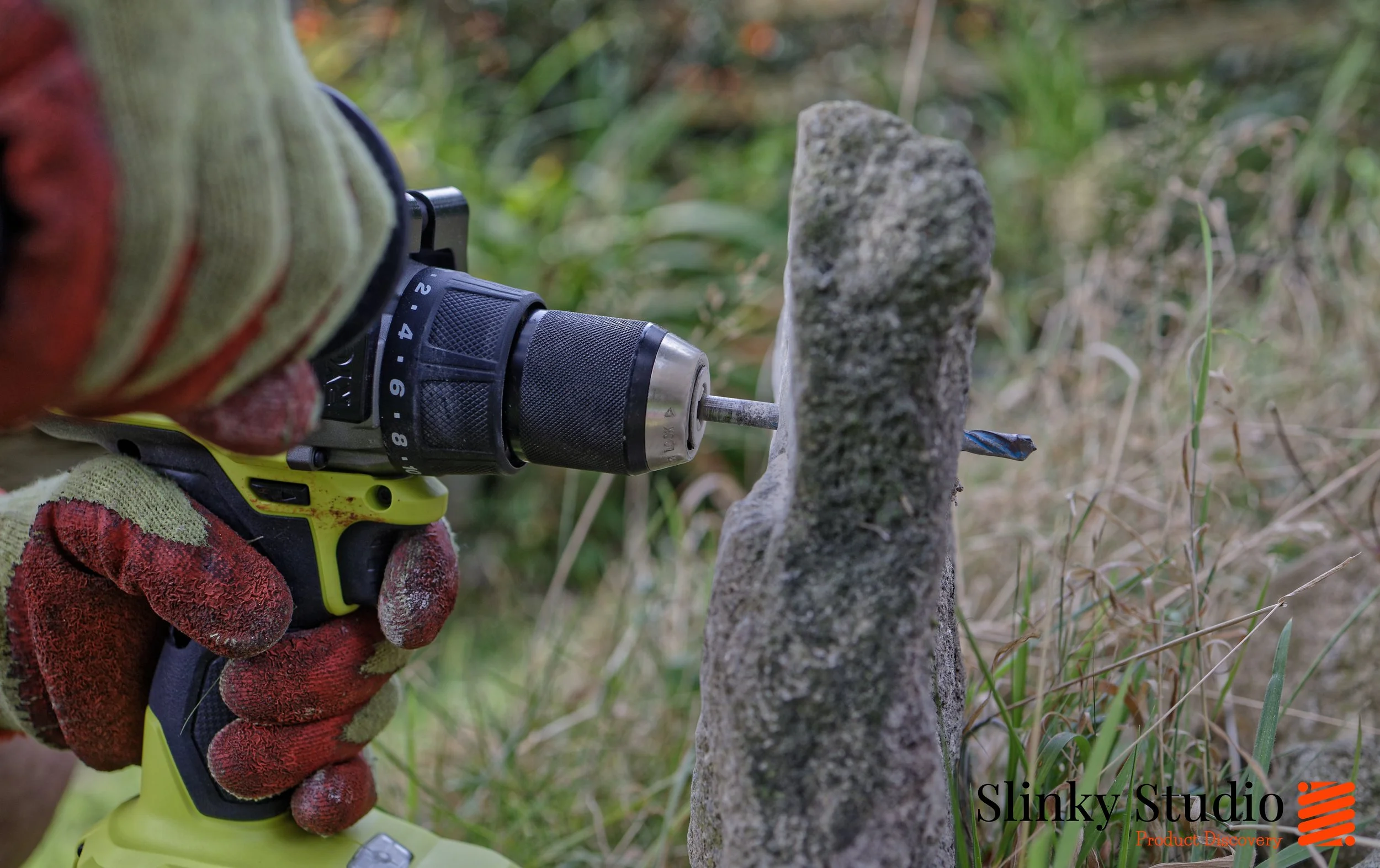 Ryobi ONE+ RPD18X1-0 HP Brushless Percussion Drill Hammer Drilling through granite stone.jpg