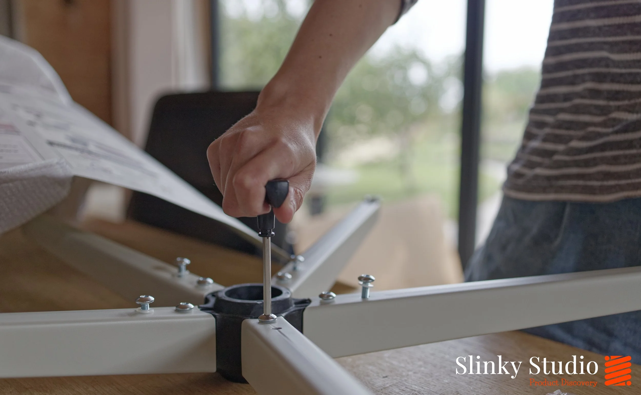MUSSO E80 Office Chair Screwing Base Together.jpg