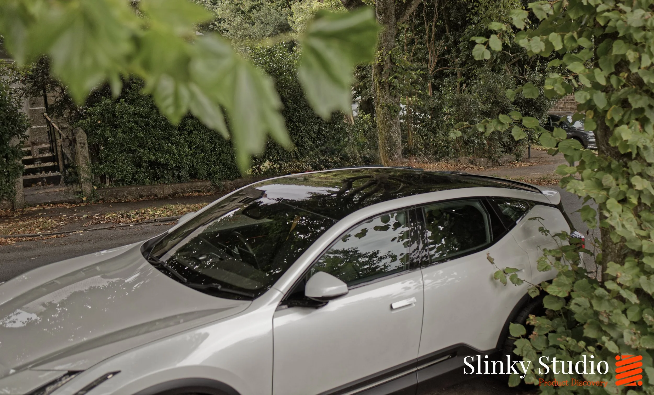 Polestar 3 Side Above View Leafy Street Autumn.jpg