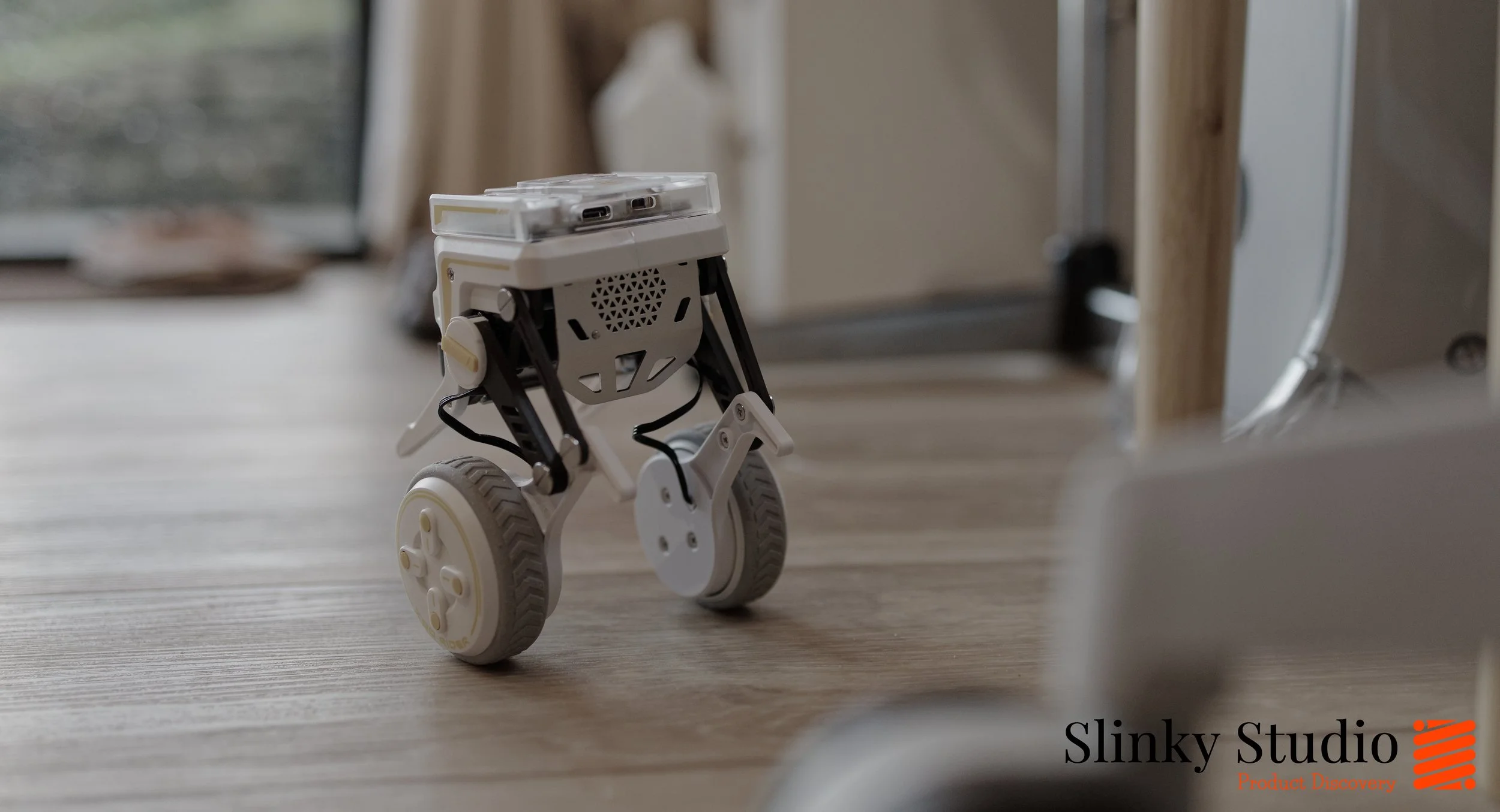 ELECFREAKS micro:bit XGO Rider Robot Moving Around on Wooden Floor.jpg