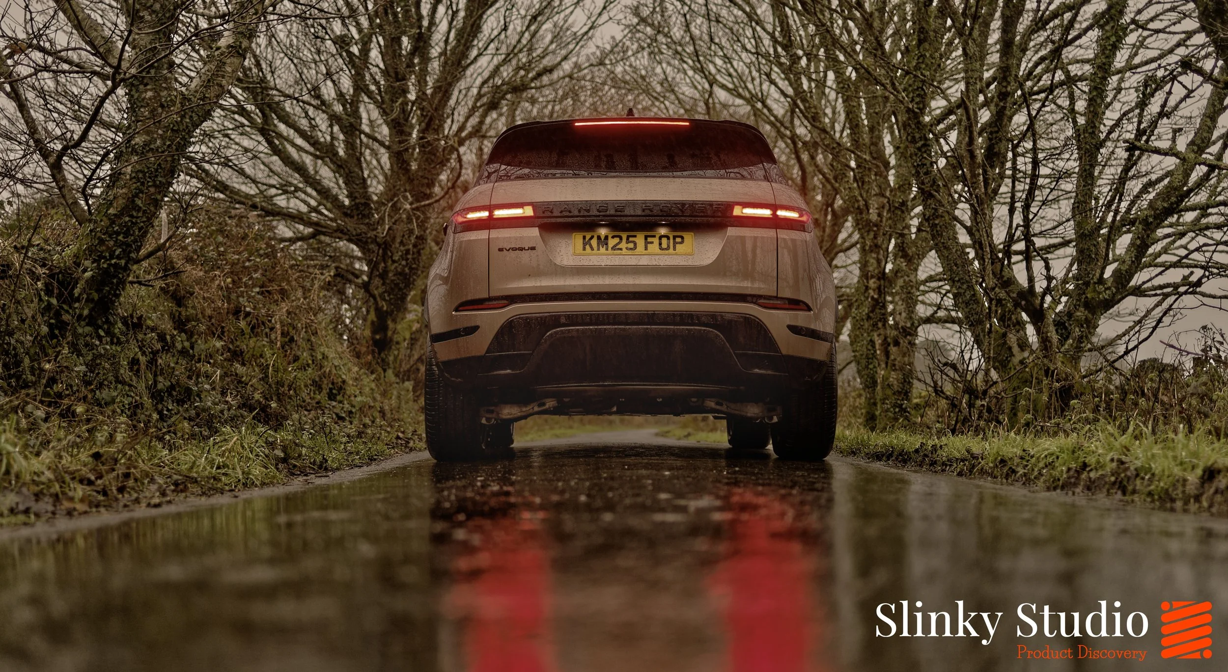 Range Rover Evoque P270e PHEV Plug-in Hybrid Corinthian Bronze Rear Brake Lights in Rain.jpg