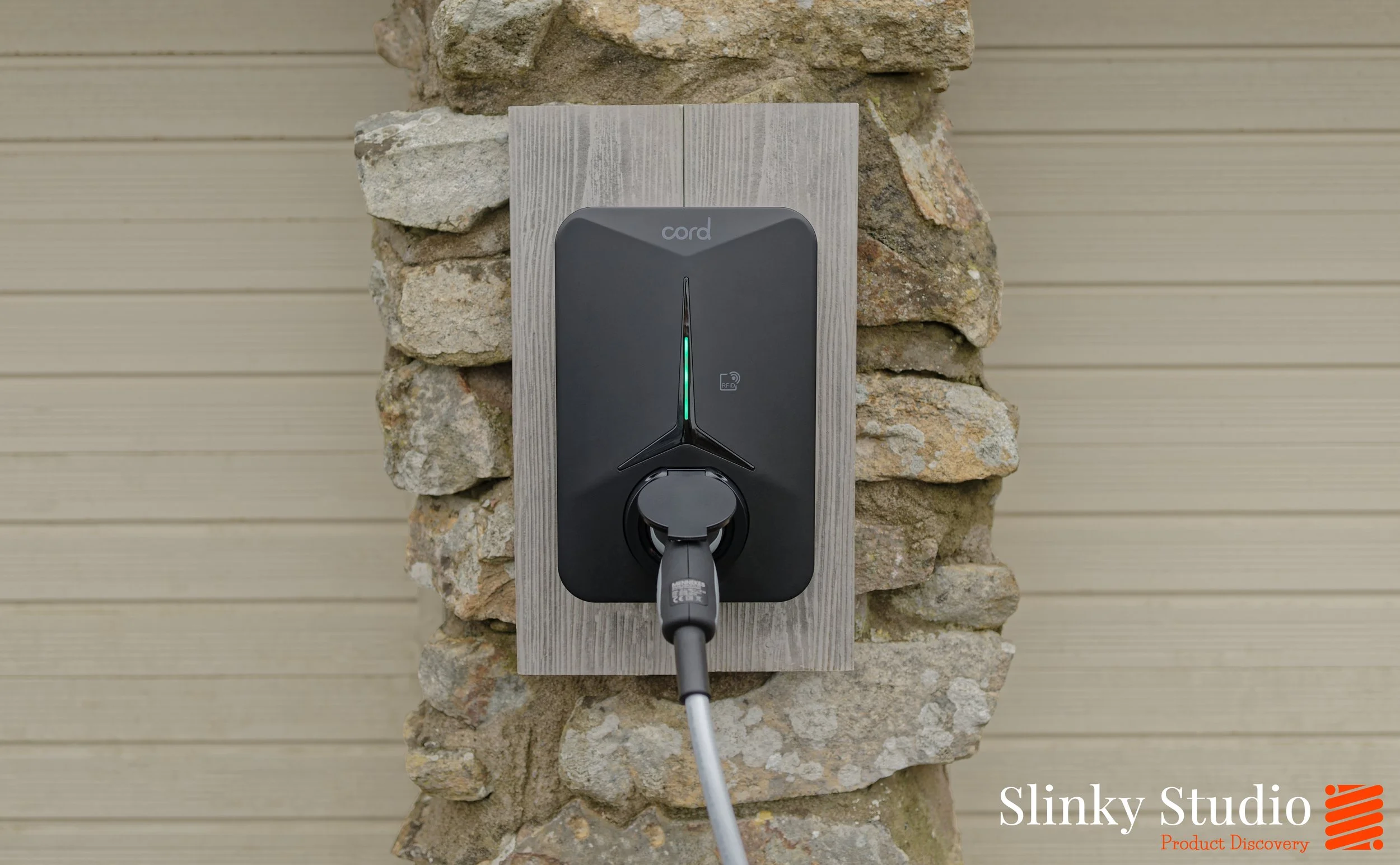 Cord Zero EV Charger Black Mounted on Cornish Granite Wall Double Garage.jpg