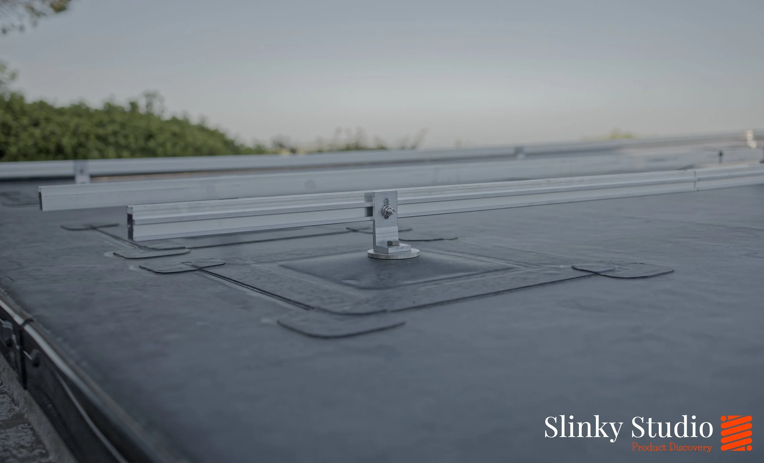 Nicholson ROOFTRAK IFP250 installed on Flat EPDM Membrane Roof Rails Layout Side On Close Up.jpg