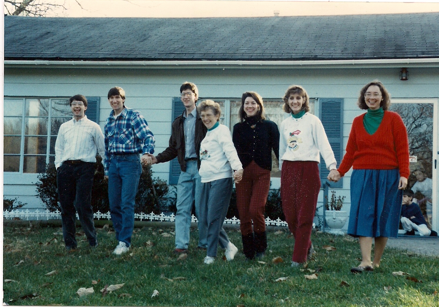 Nona surrounded by her children standing in front of their Sherwood home. Left to right: John, Joe, Paul, Nona, Ruth, Mary, Anna