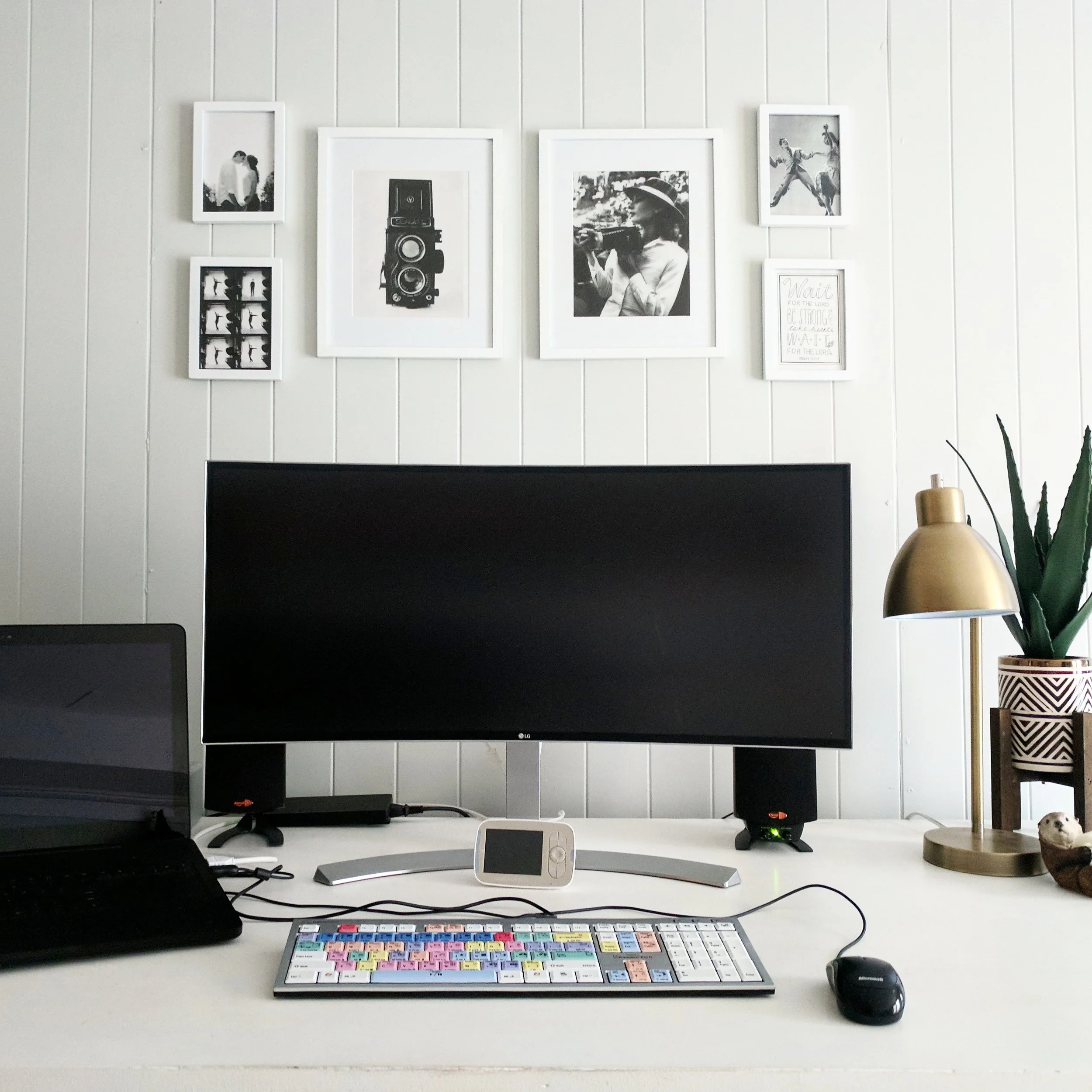 My desk setup - 34" curved ultrawide monitor, editing keyboard, and Razer Blade Pro.