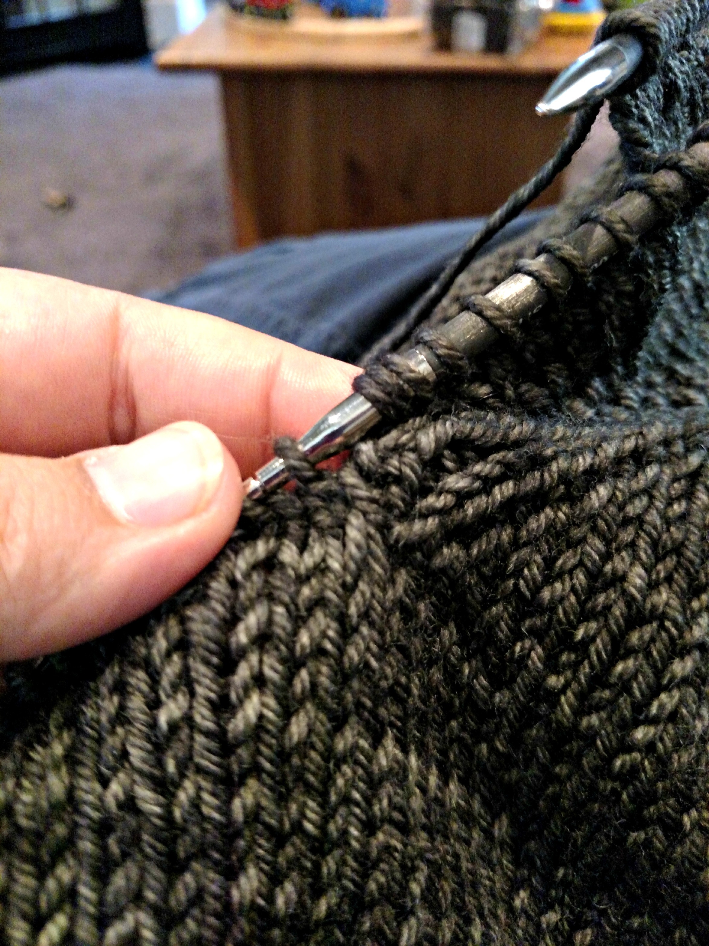 coming to the end of the first complete round, right at the junction of the underarm and the sleeve cap