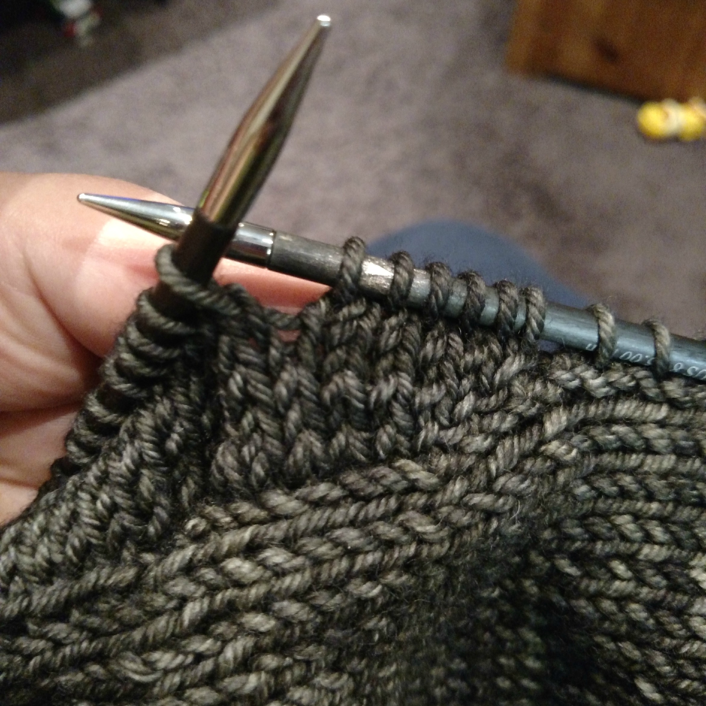 Beginning the short rows--about 3 or 4 short rows worked. Note the wrapped stitch, 6 stitches in from the tip of the right hand needle 