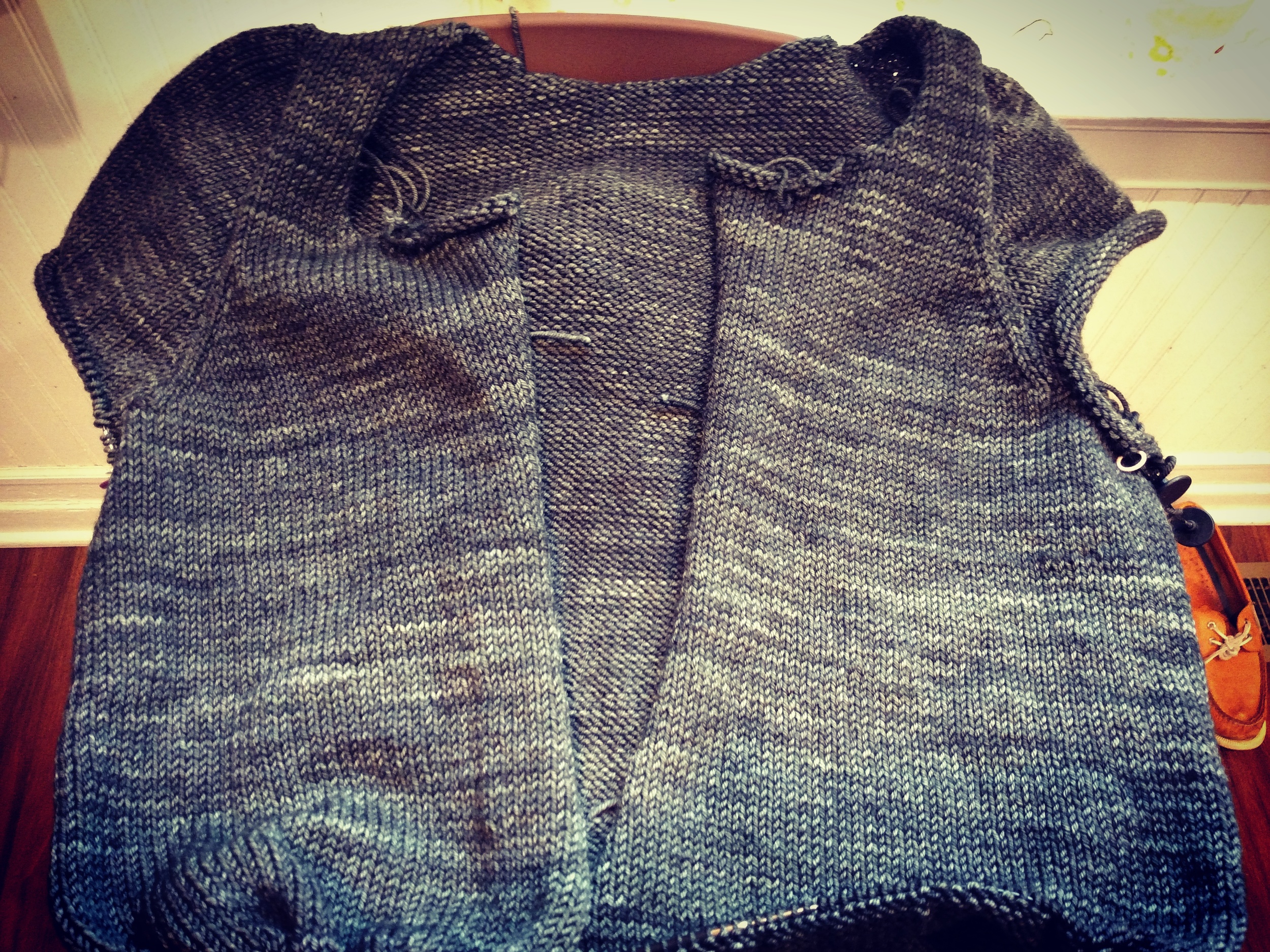 pre-sleeves and button bands, and pre blocking. compare this to the blocked one above. the final finished fabric on the blocked one is smoother and more even, lies flat (helped along by the button bands, but still)