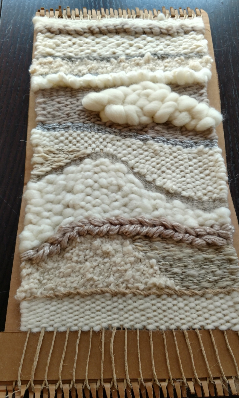 a wall hanging done with a jute twine warp