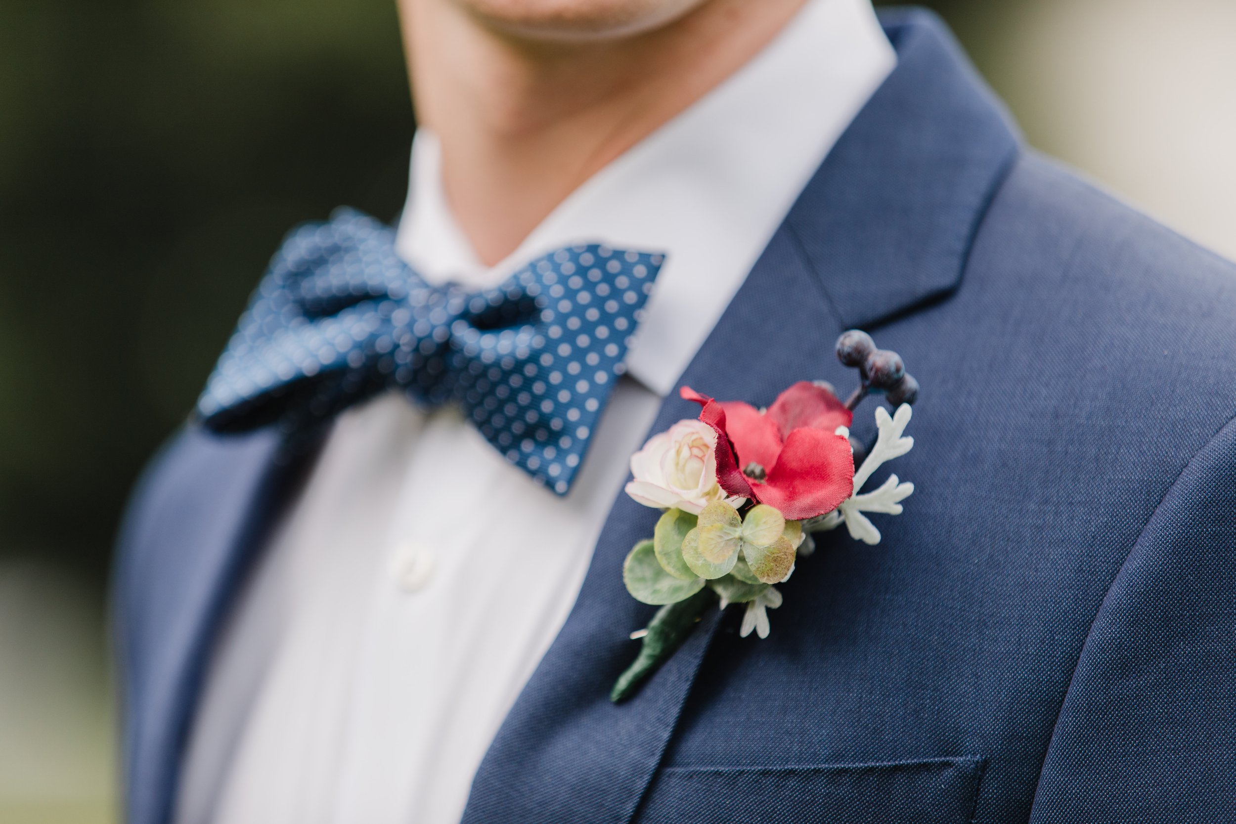 groom with navy blue suit and bow tie (Copy)