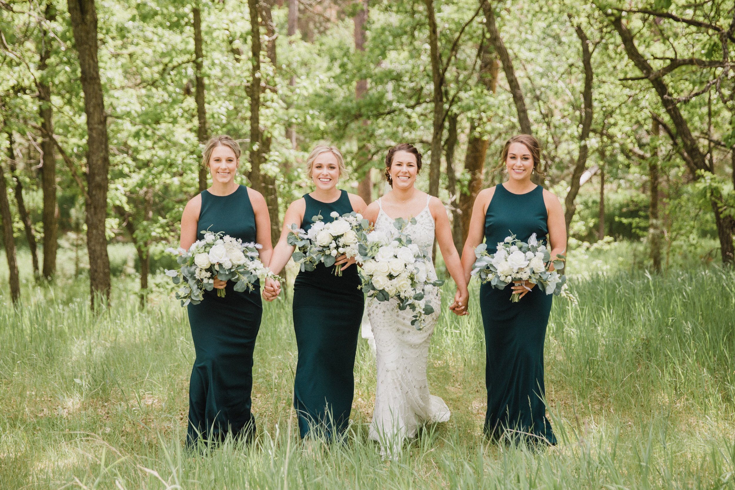 bride and bridesmaids wearing emerald green dresses (Copy)