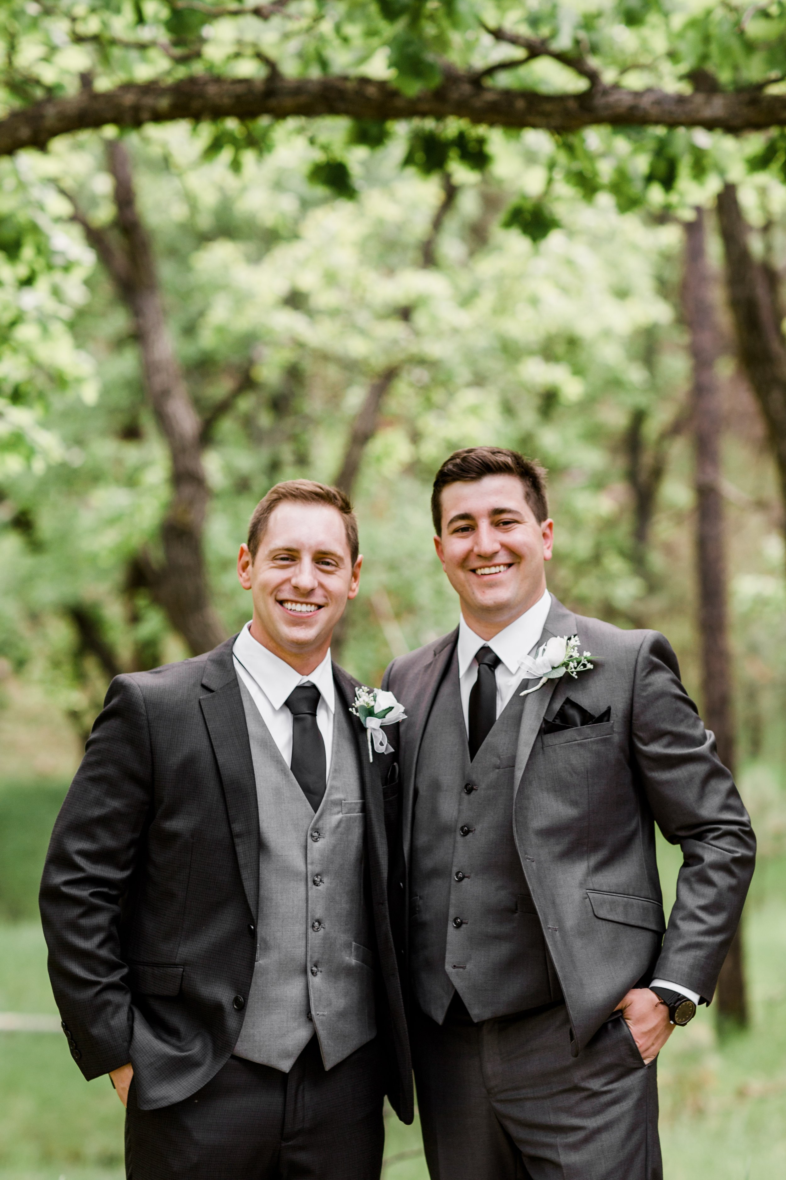 groom and groomsmen wearing black suits at Custer state game lodge (Copy)