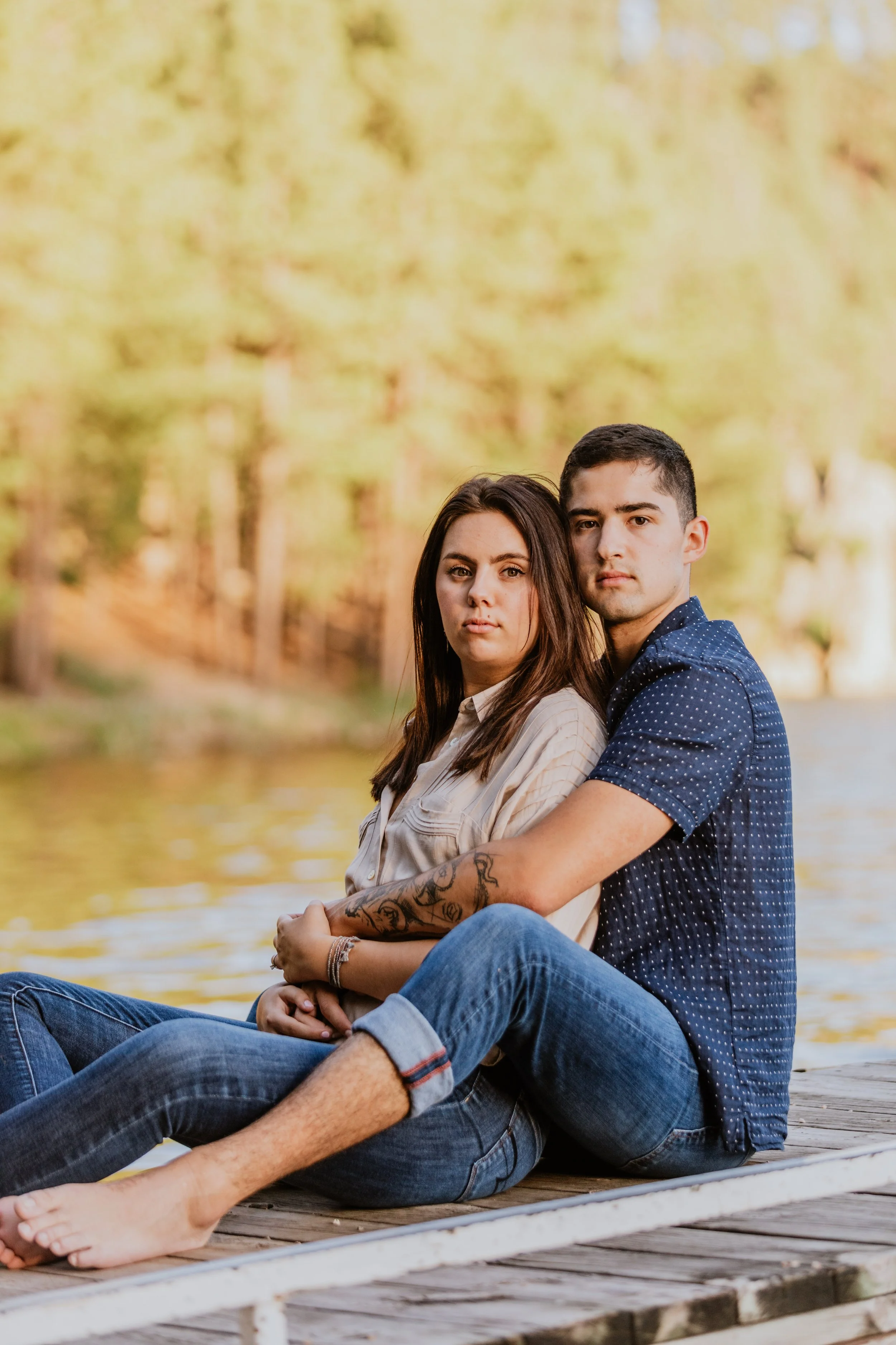 dramatic couple wearing neutral colors at their engagement session