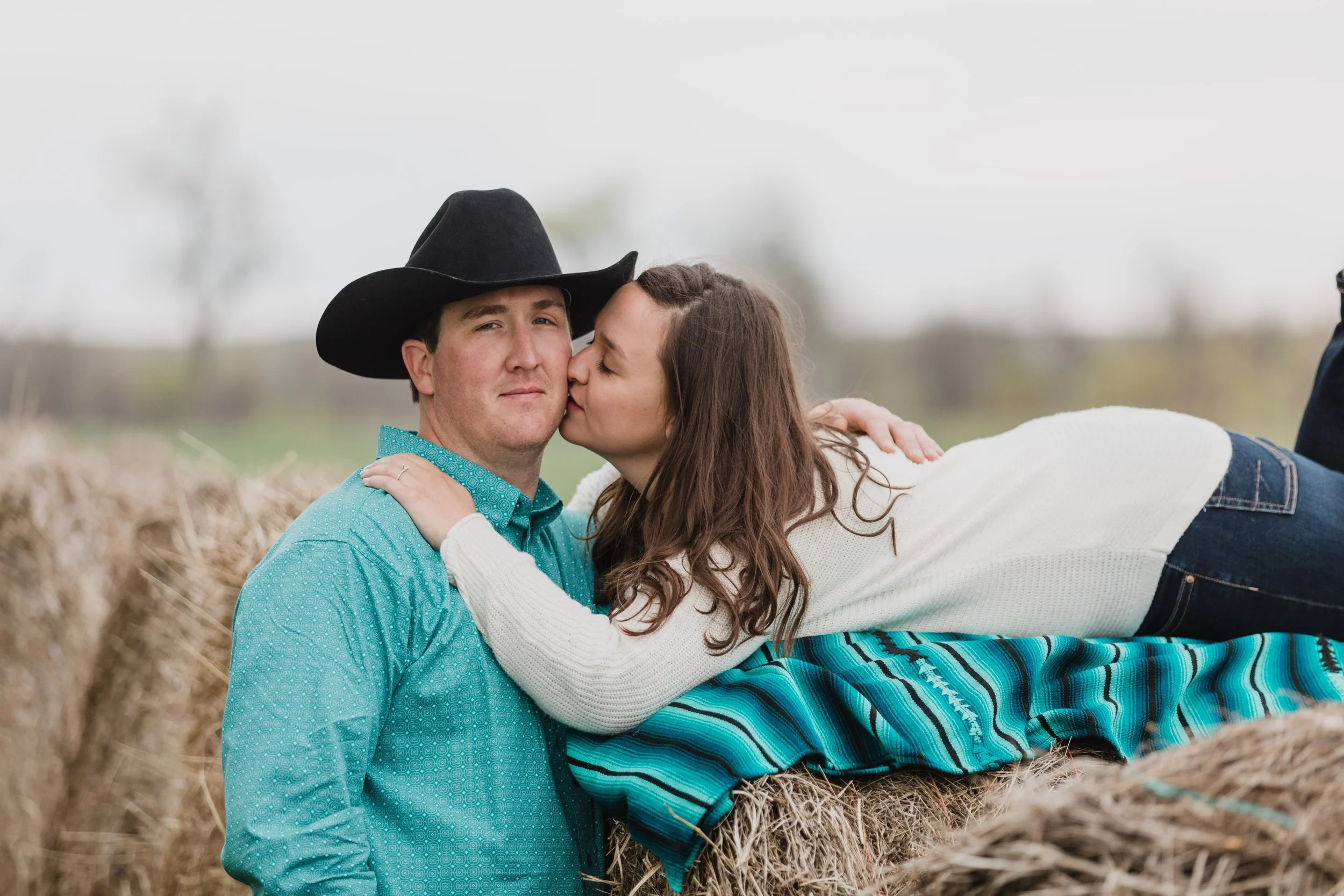 western couple by hay bales near new underwood, sd