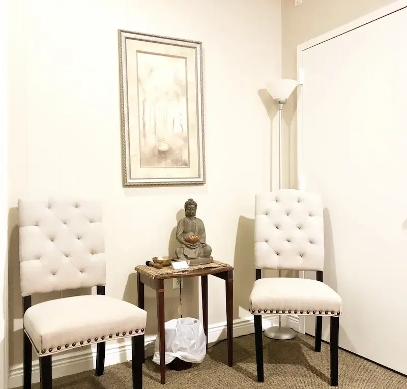 Waiting room with two chairs inside therapy office