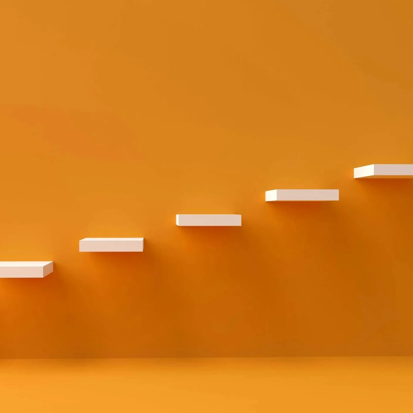 White floating steps against an orange wall.