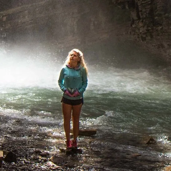 Woman walking through misty water