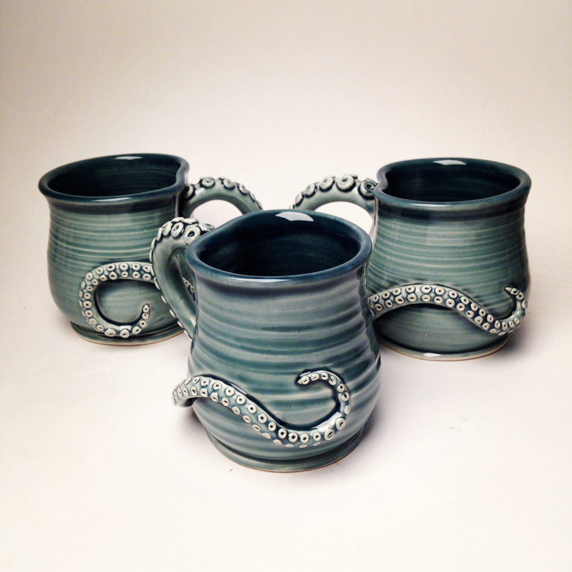 Mugs, 2013. White stoneware fired to cone 6 oxidation.