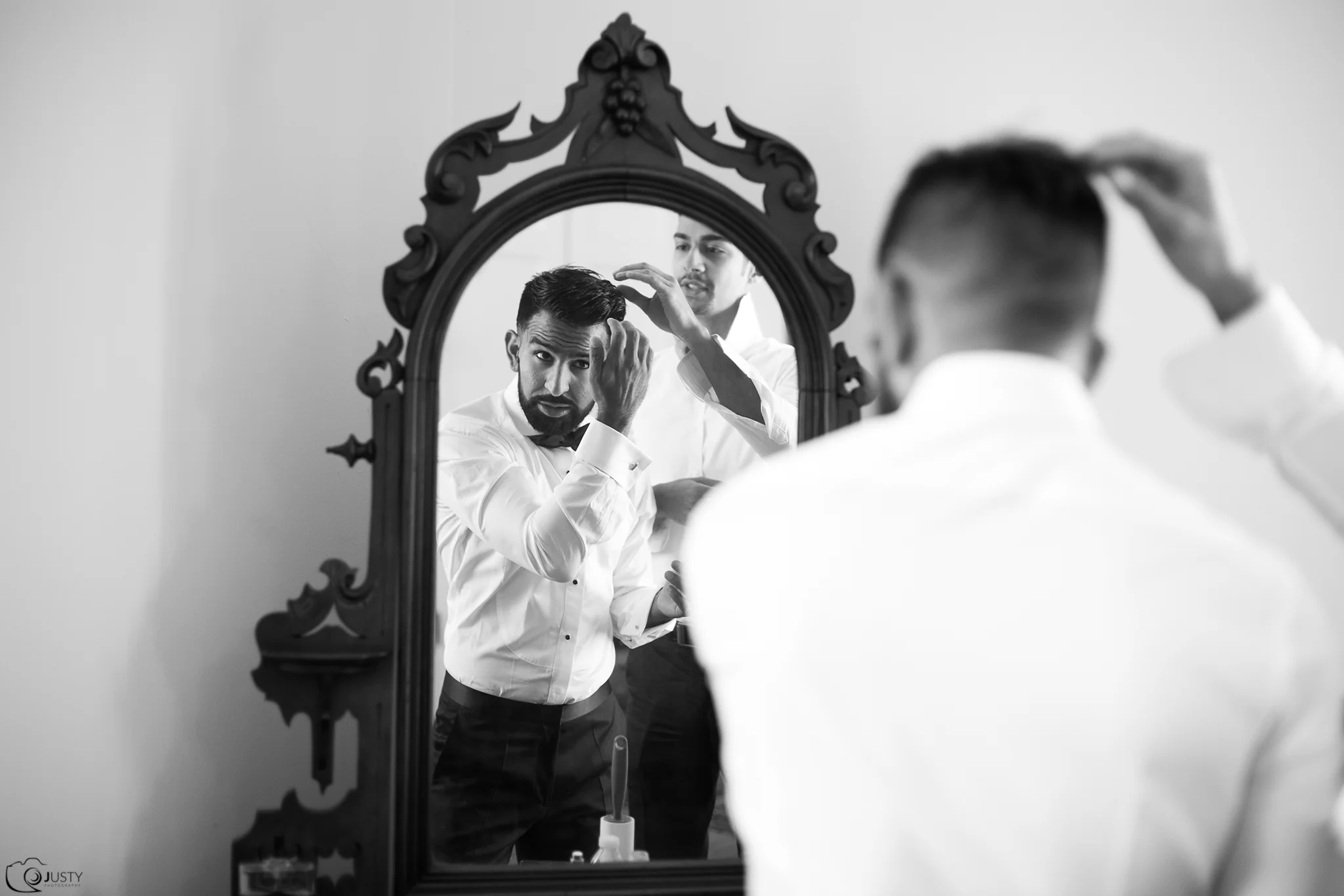 Groom getting ready at Strong Mansion Wedding