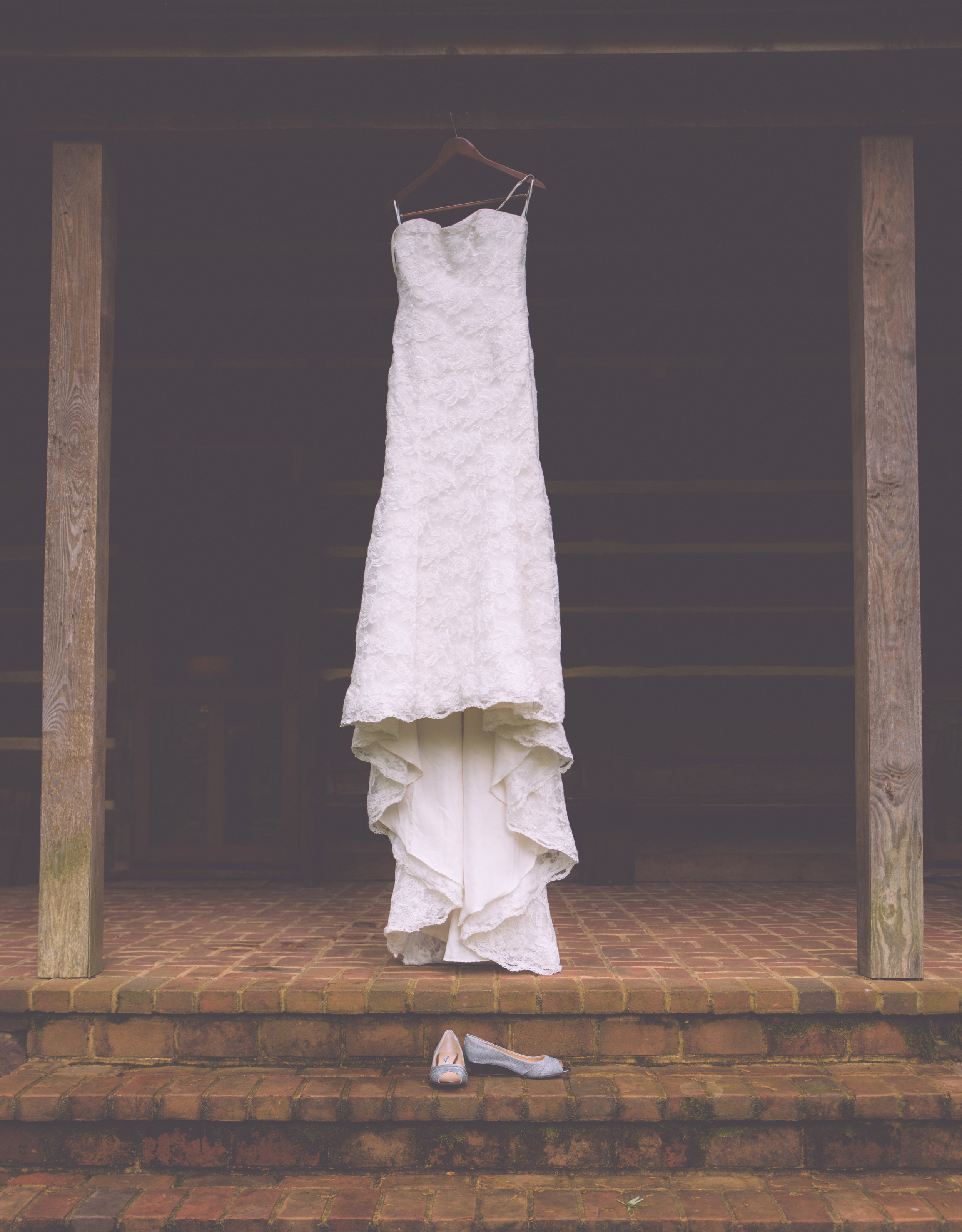  Brides Dress and shoes hanging outside 