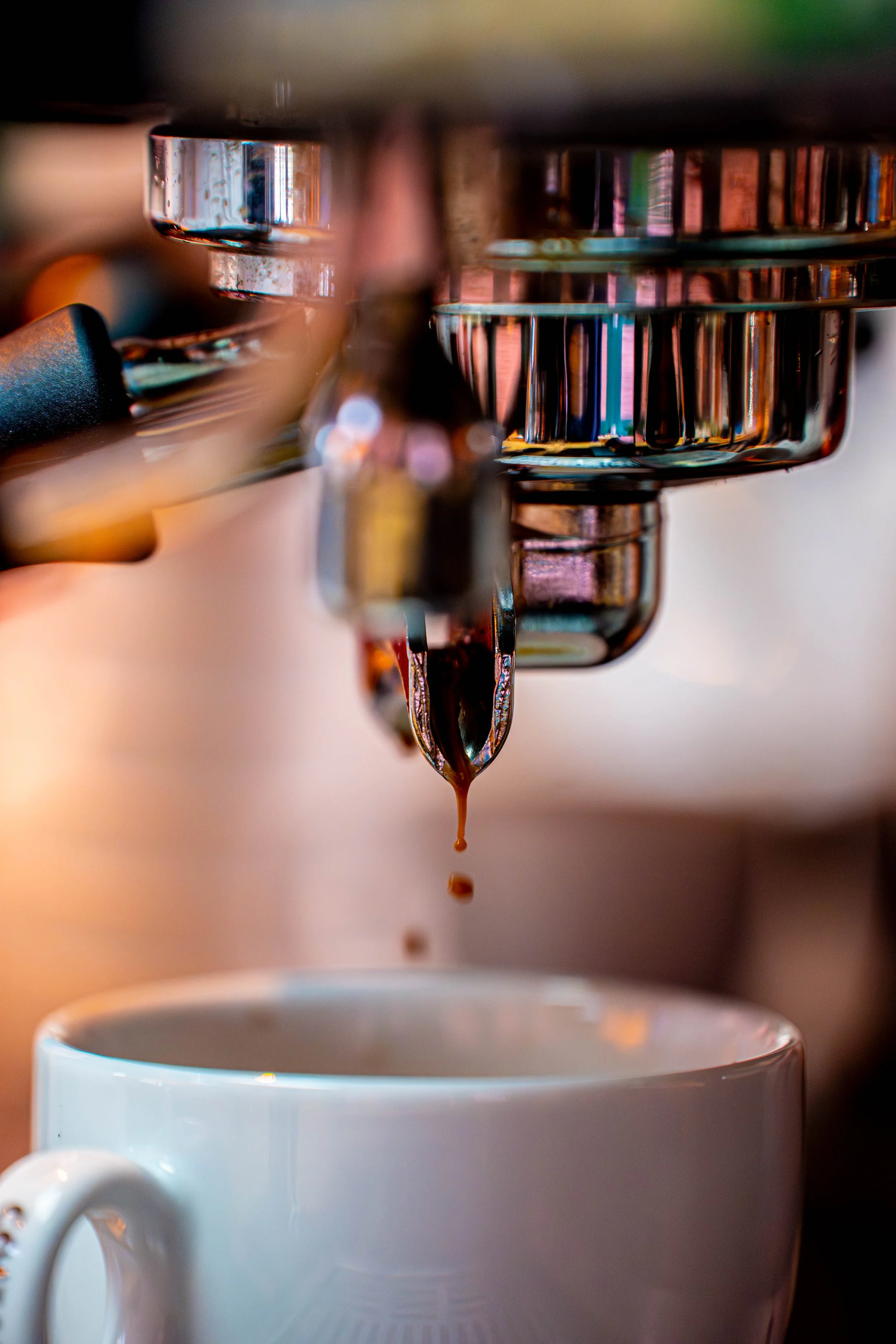 Espresso machine pouring coffee into a cup