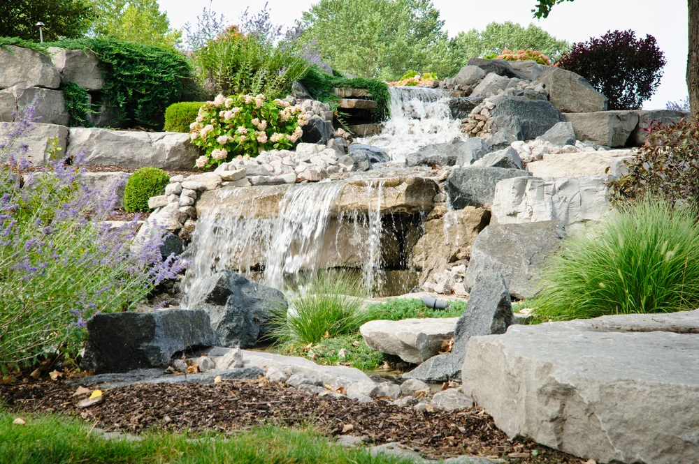 Esch Landscaping - Water Feature - Tiered Rock Waterfall with Plants (1).jpg