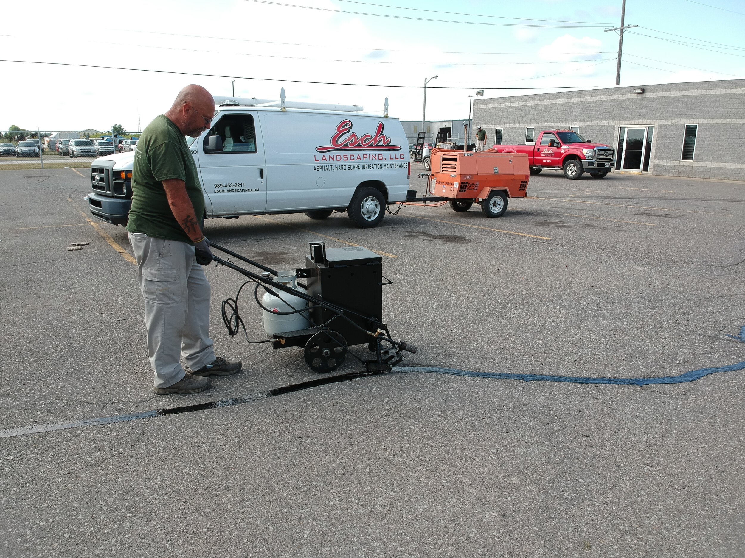 Esch Landscaping - Asphalt - Crack Fill Commercial Parking Lot.JPG