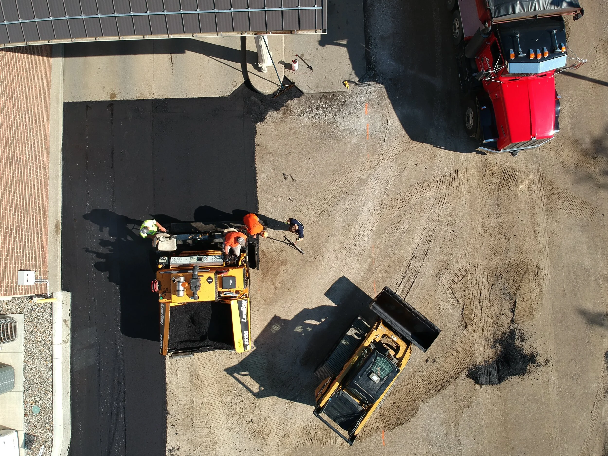 Esch Landscaping - Asphalt - Commercial Parking Lot Project - aerial view - skid, paver, flowboy.JPG