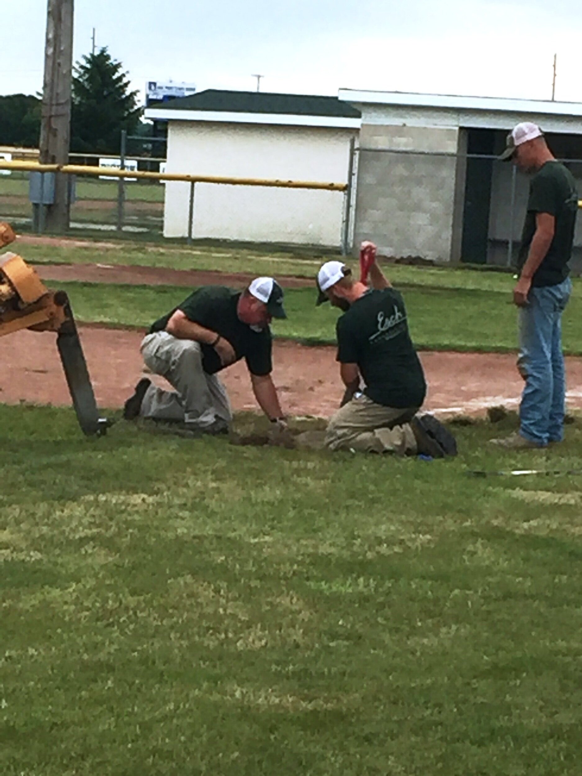 Rick Cottrell installing a new irrigation system.JPG