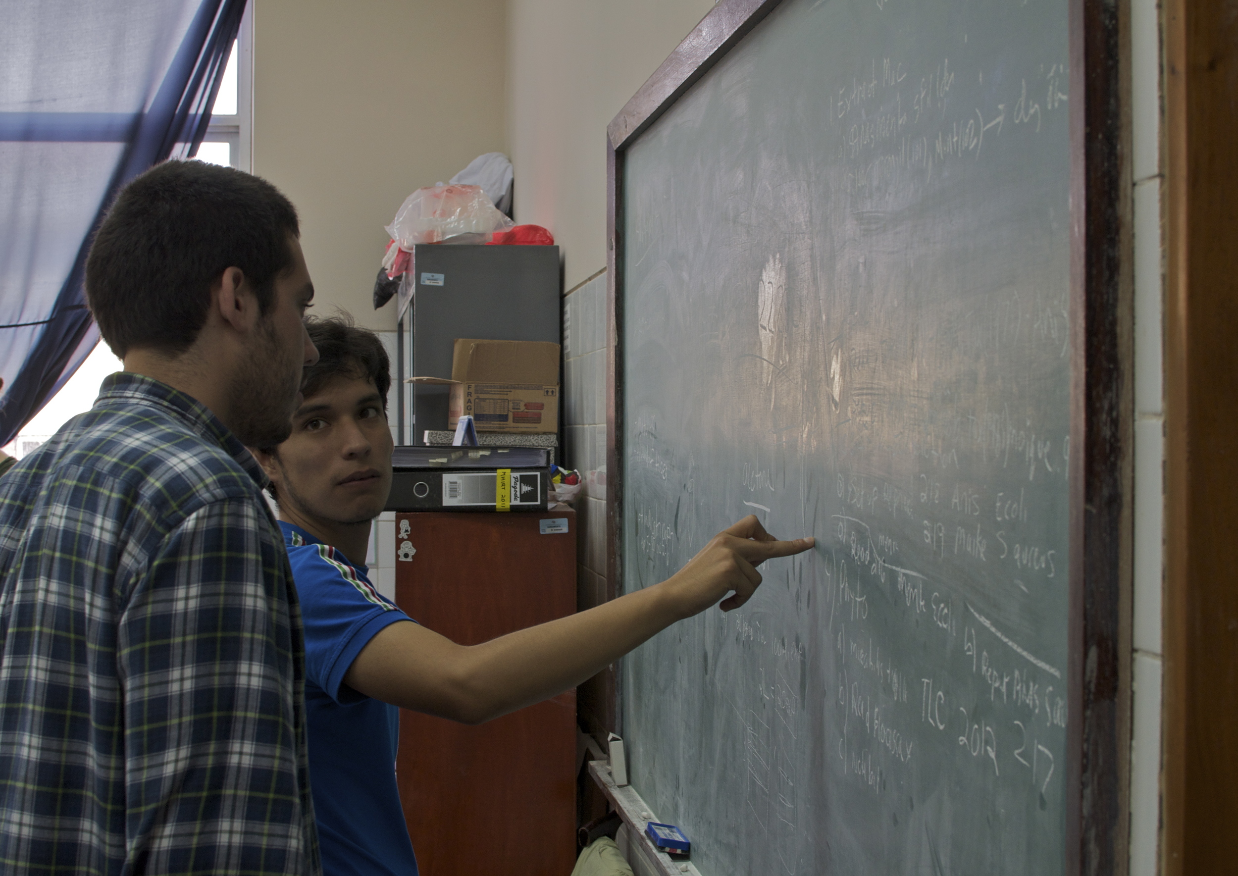 June 2014 - Alejandro Irtube aids MHIRT student Abelardo Arellano the UNT lab. 