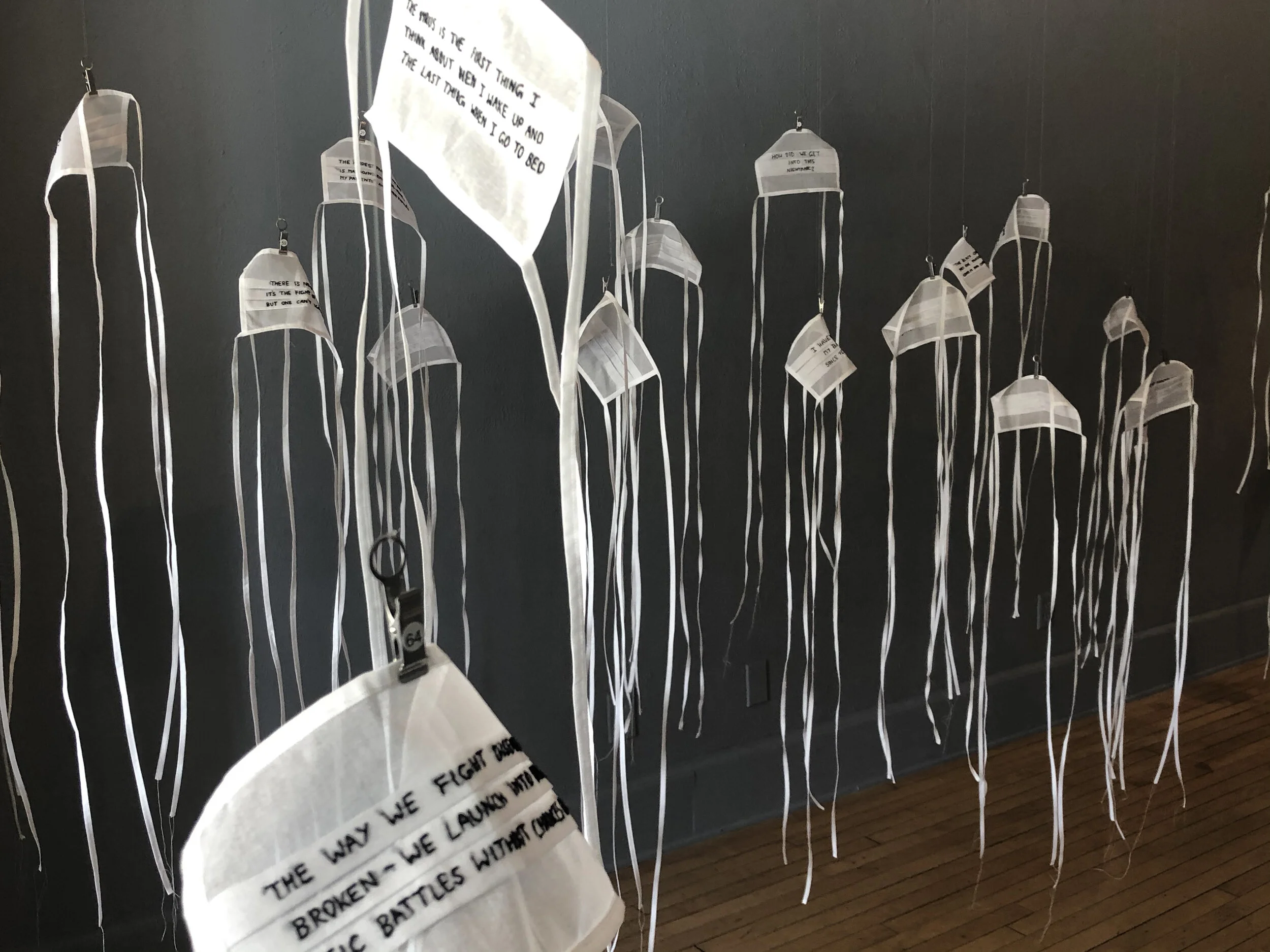 Feeble Barriers - 101 hand embroidered masks with quotes from healthcare workers