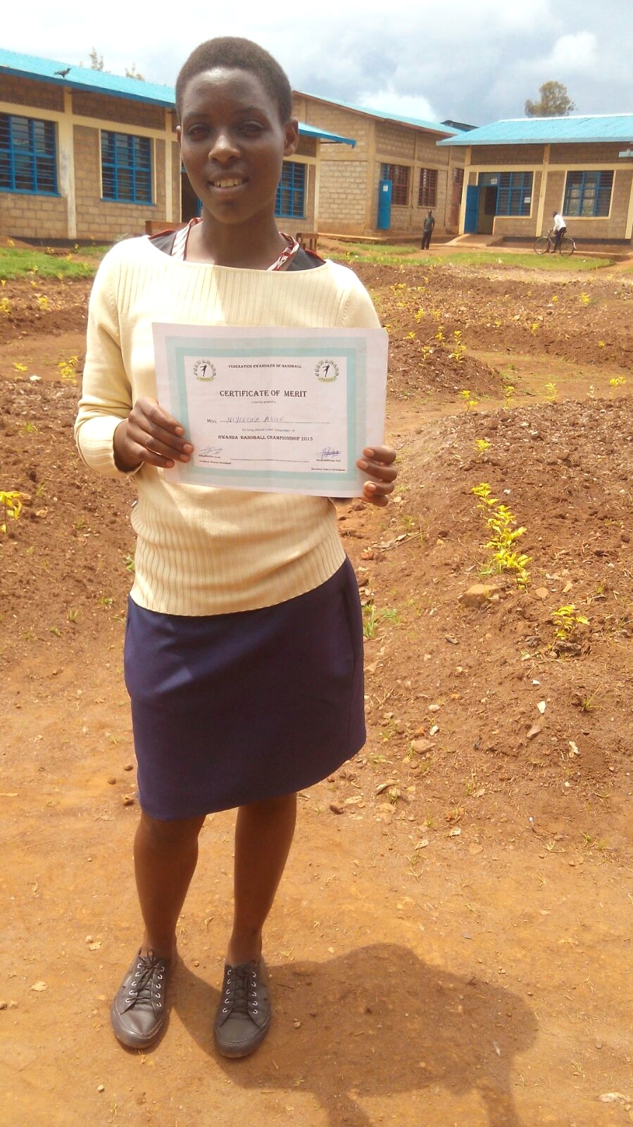 Alice holding her certificate