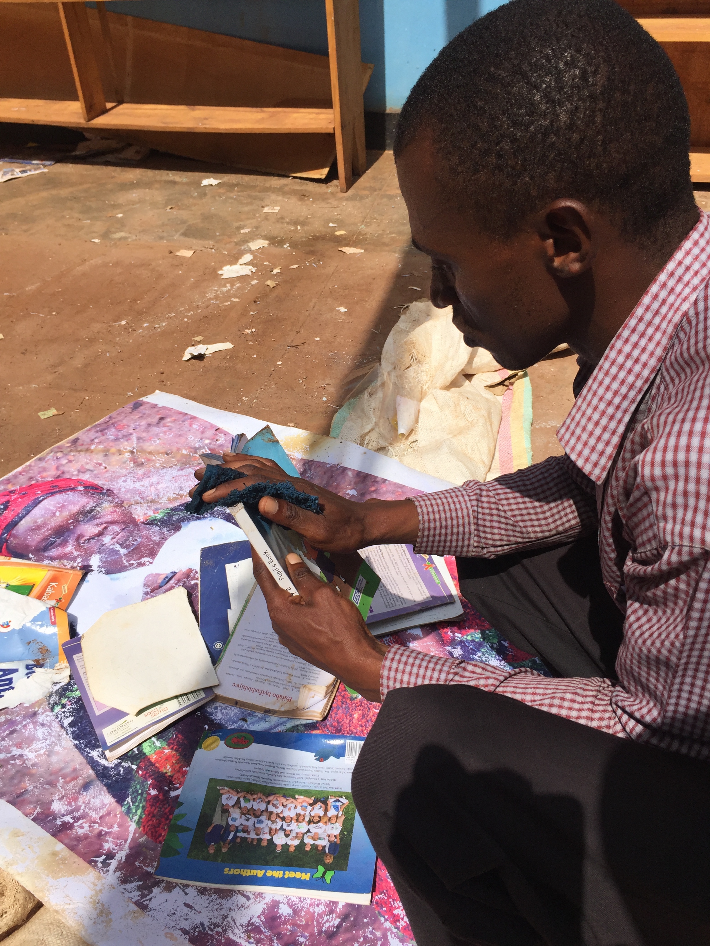 Eugene, REAP employee cleans water-damaged books.